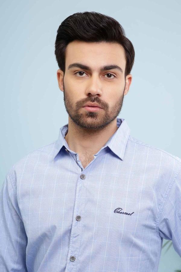 Men's slim-fit light blue button-down shirt with collar and chest logo detail