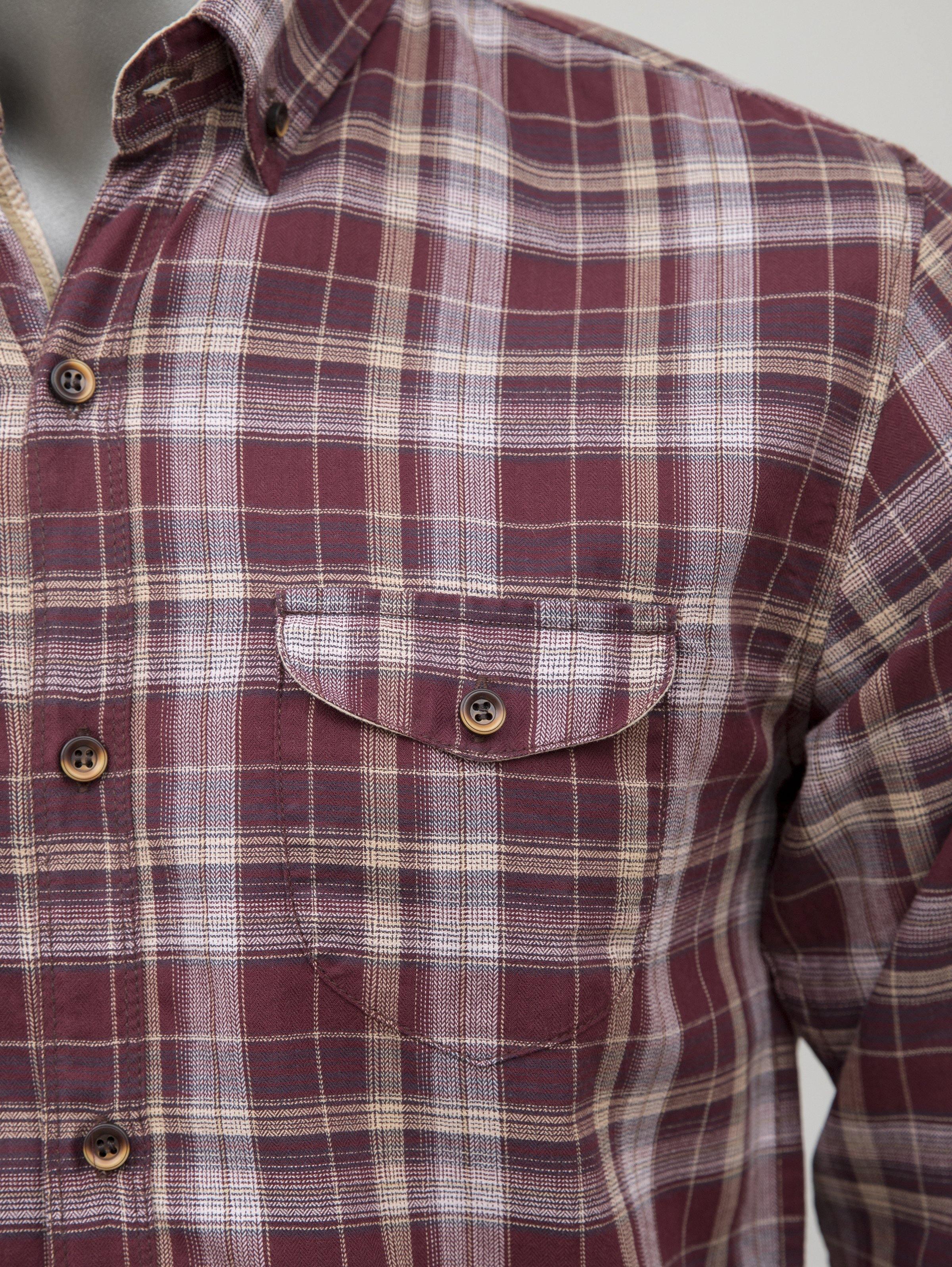 Maroon plaid button-up shirt front with flap chest pocket and wooden buttons
