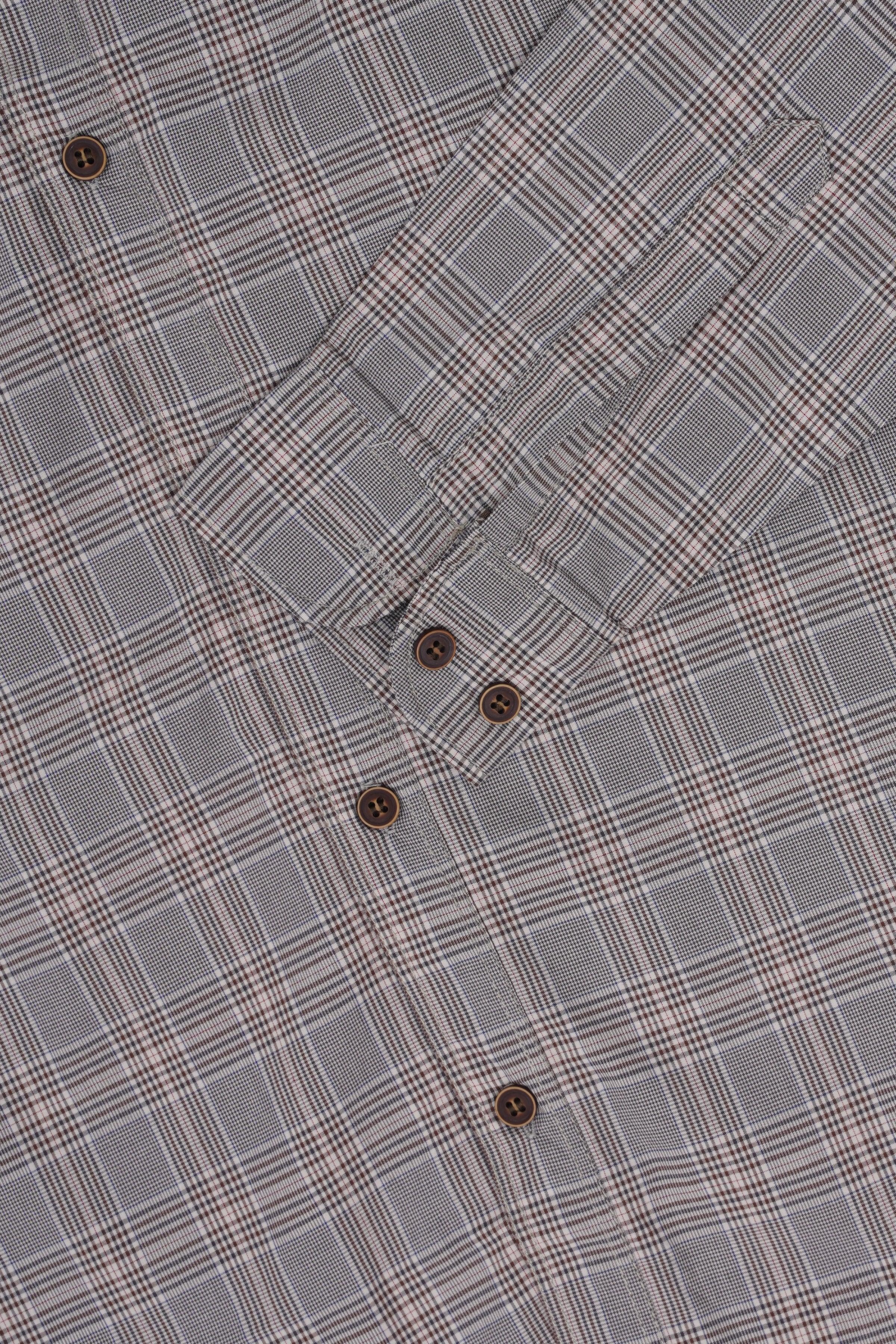 Grey plaid check shirt close-up: pointed collar, button placket, and brown buttons