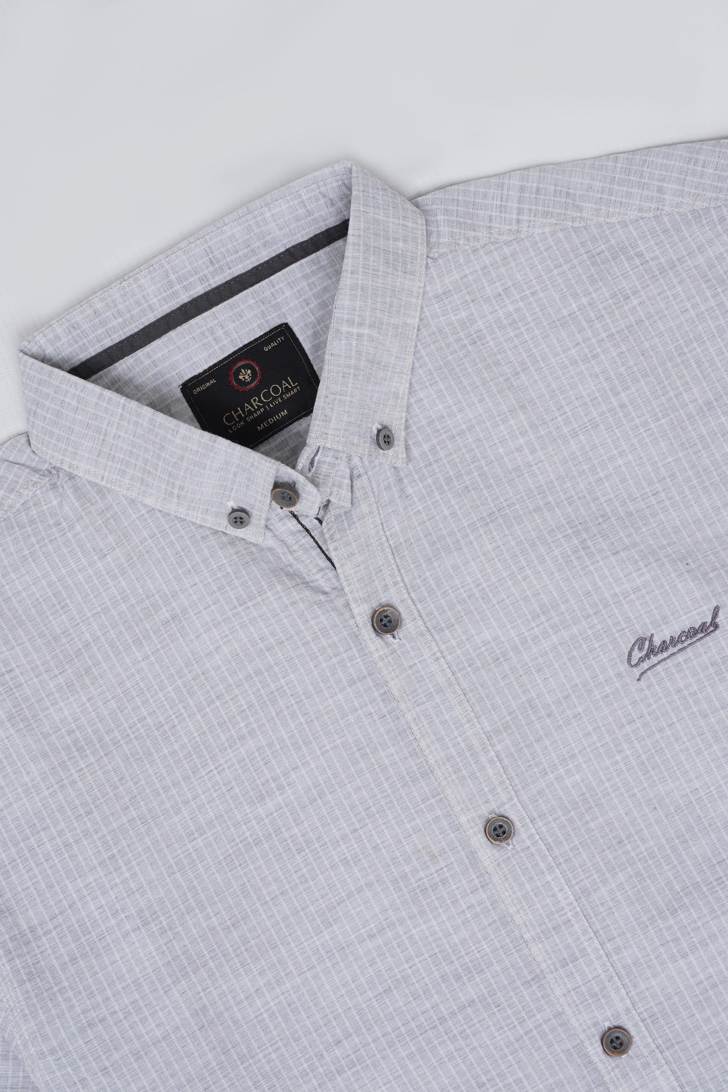 Light gray patterned button-up shirt with collar, front buttons, and small chest logo