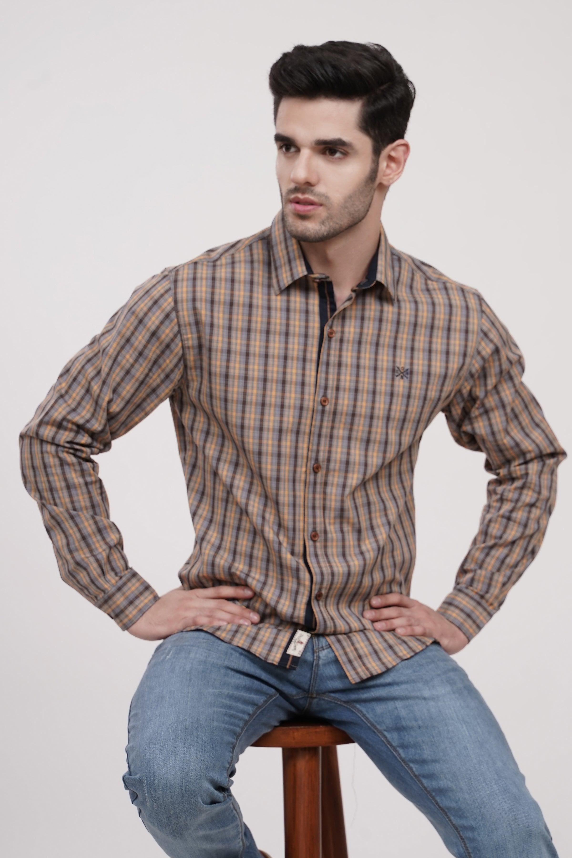 Plaid button-up casual shirt with long sleeves, brown and blue tones.