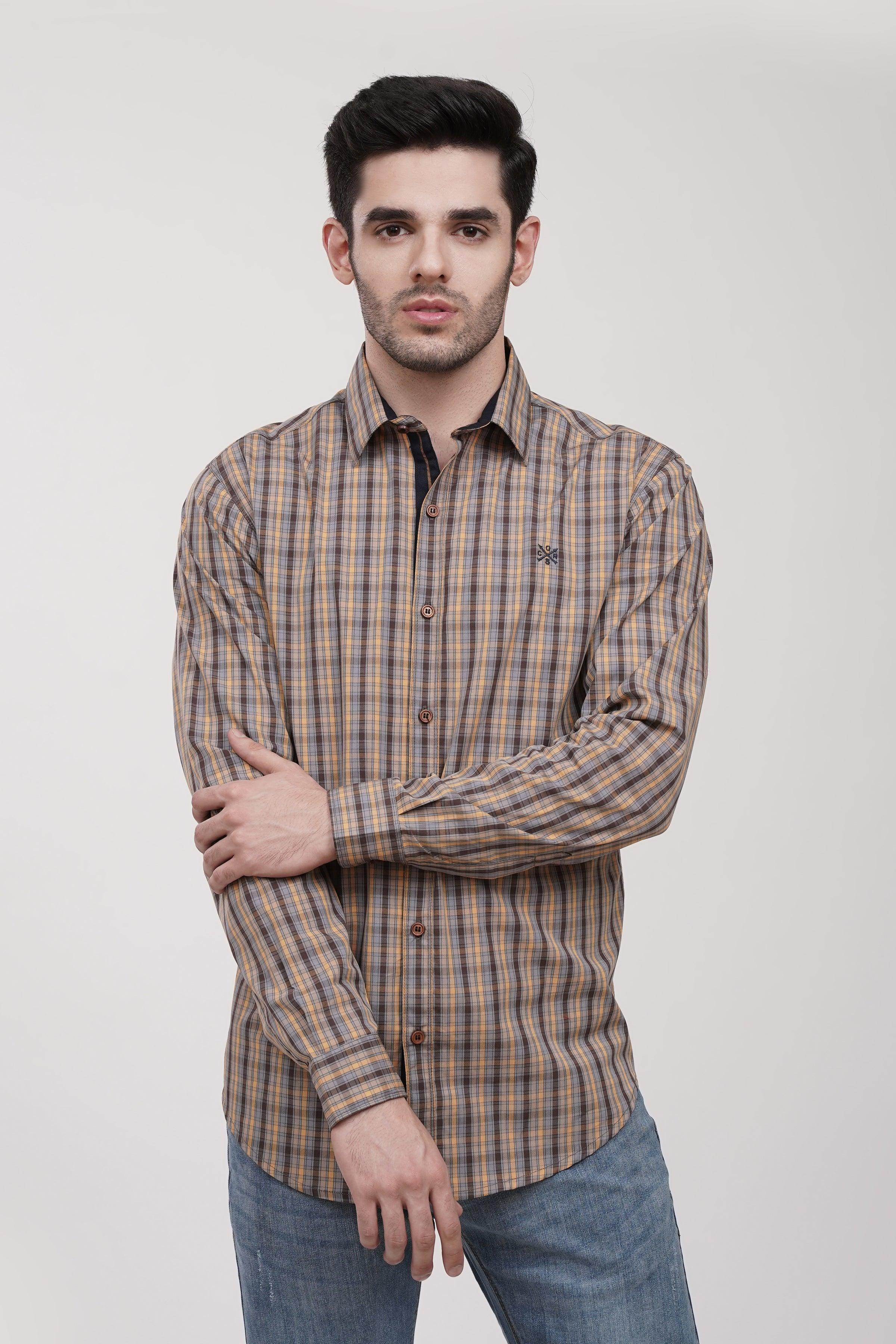 Plaid button-up casual shirt with long sleeves, brown and blue, chest pocket emblem.