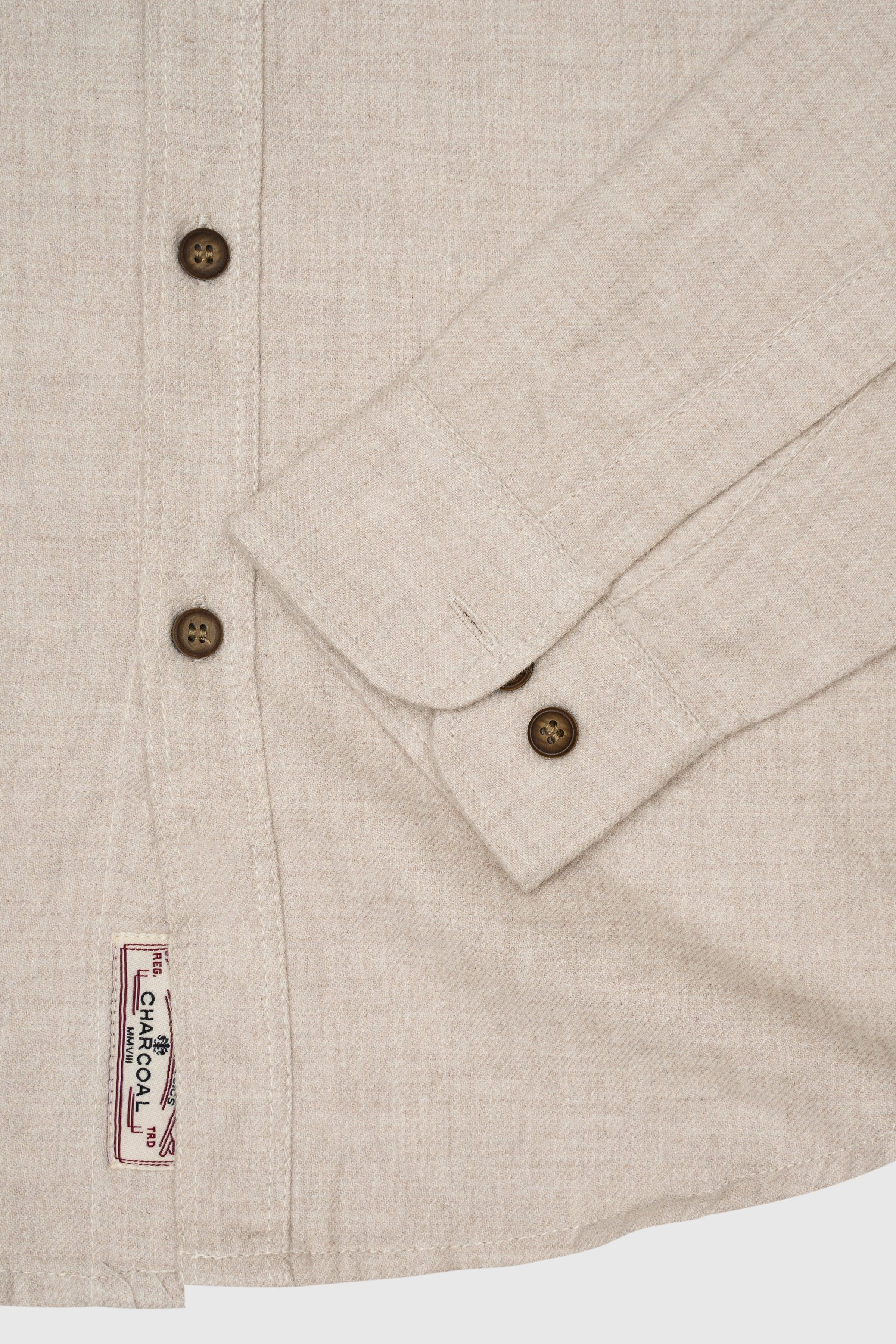 Off-white casual shirt close-up: cuff buttons and stitched hem label
