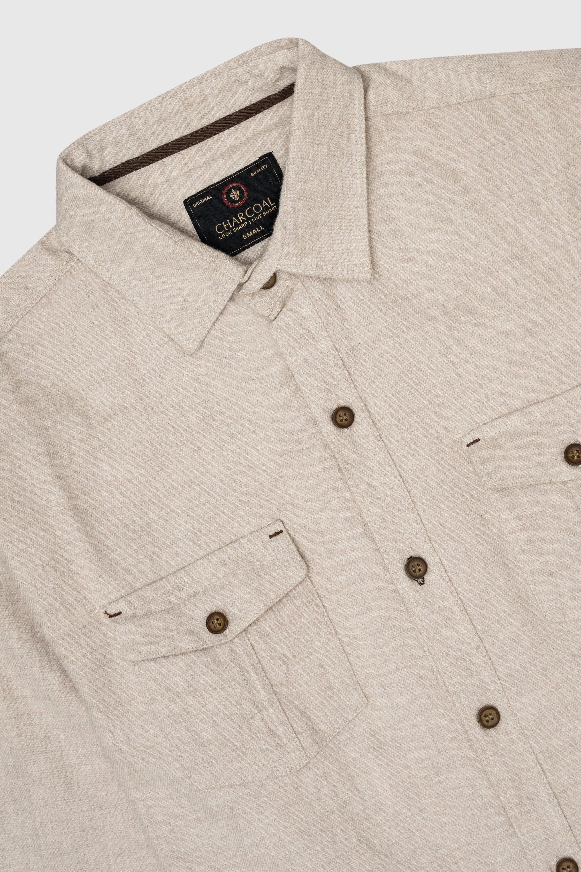 Off-white casual shirt close-up: collar, chest pockets, brown buttons