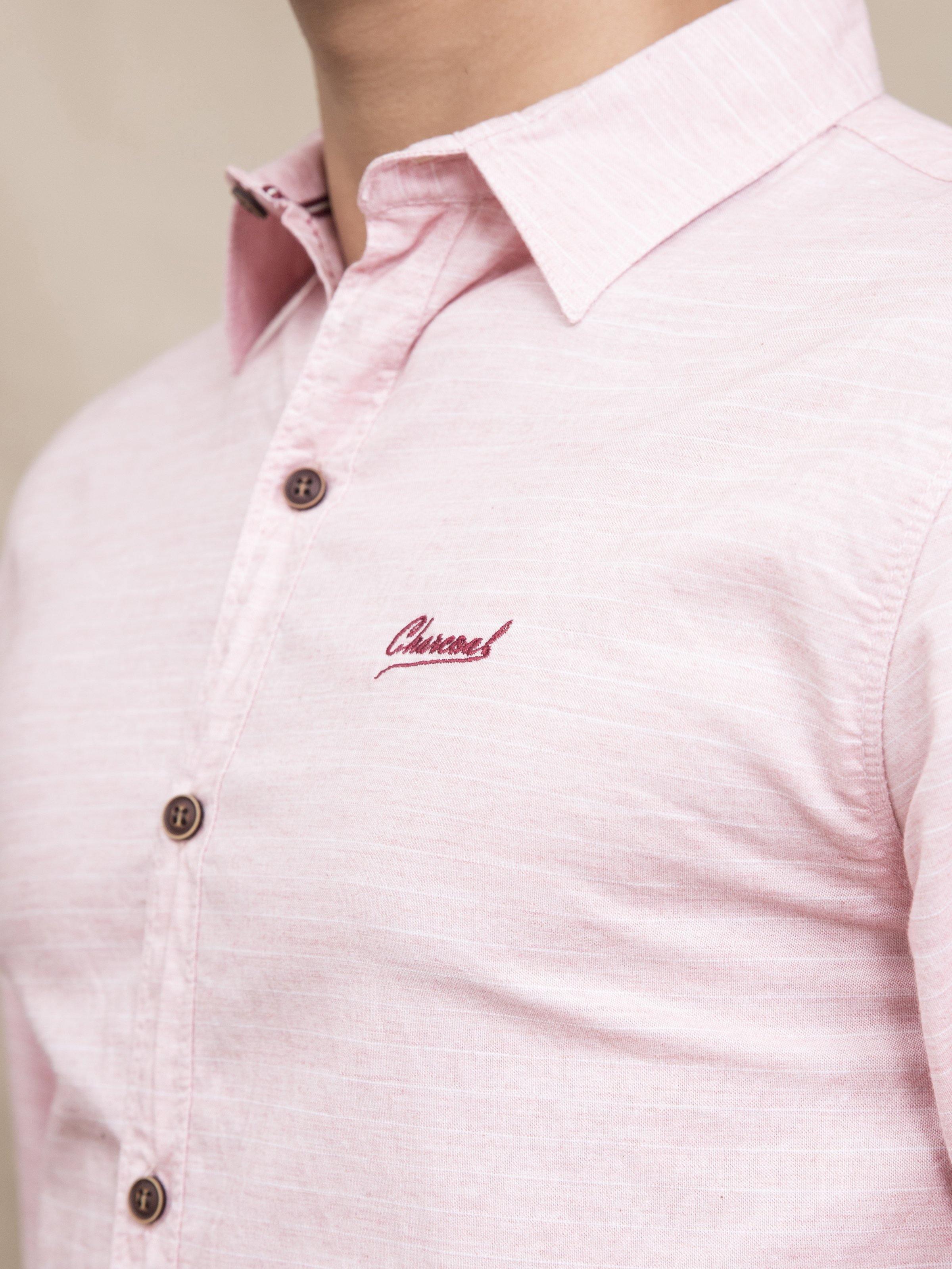 Pink shirt collar and button placket with embroidered chest logo