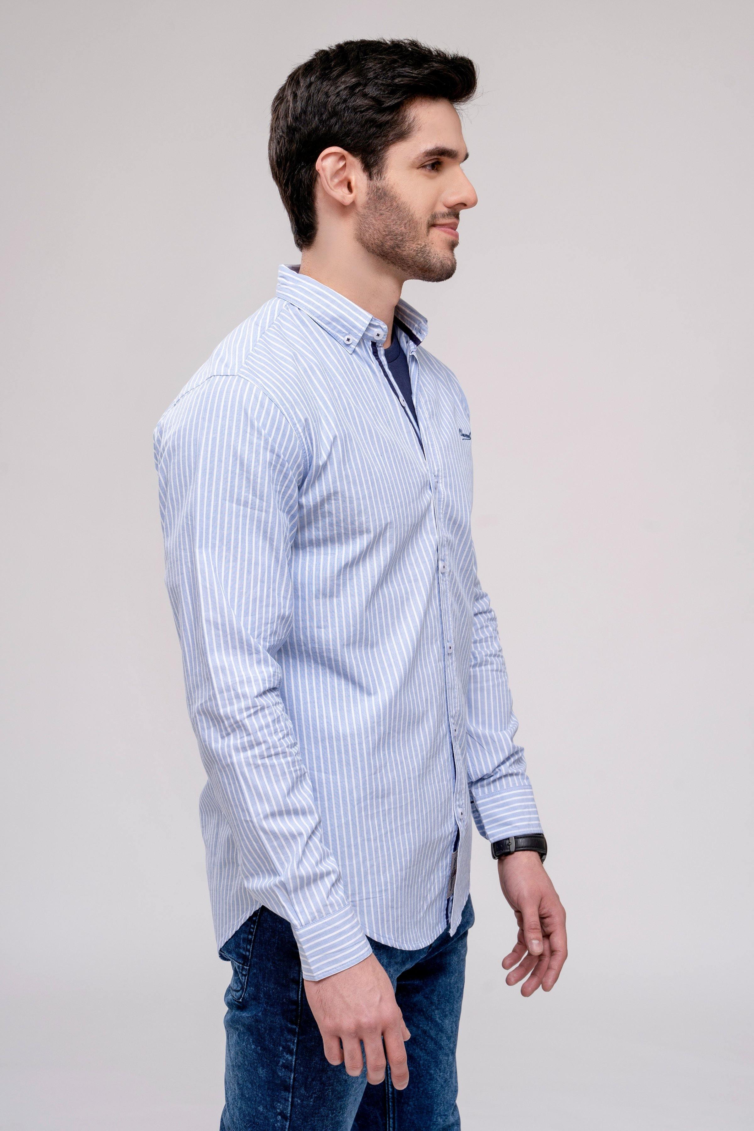 Men's casual shirt in light blue with white vertical stripes, long sleeves and button cuffs