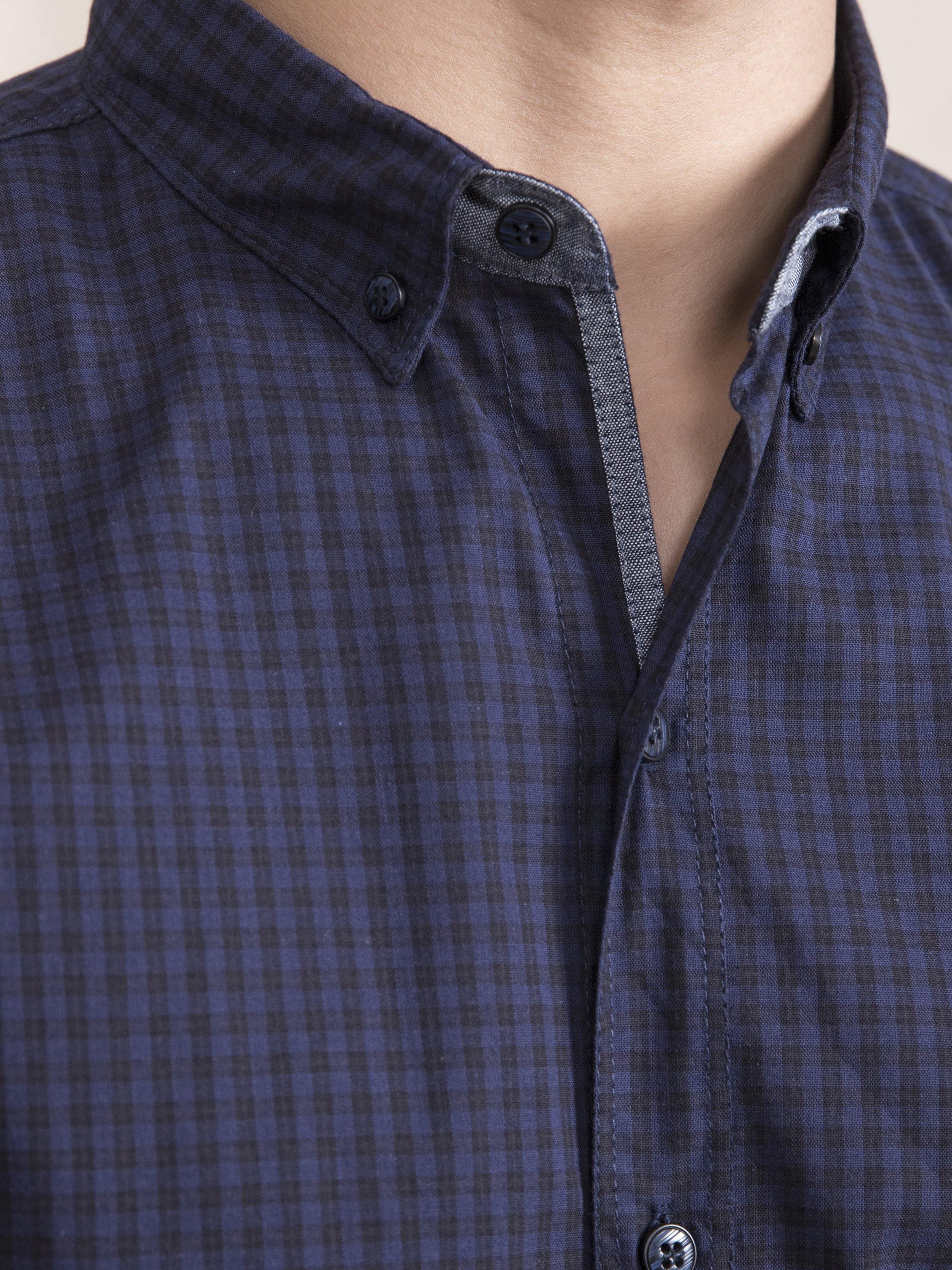 Navy checked button-down shirt placket with round buttons