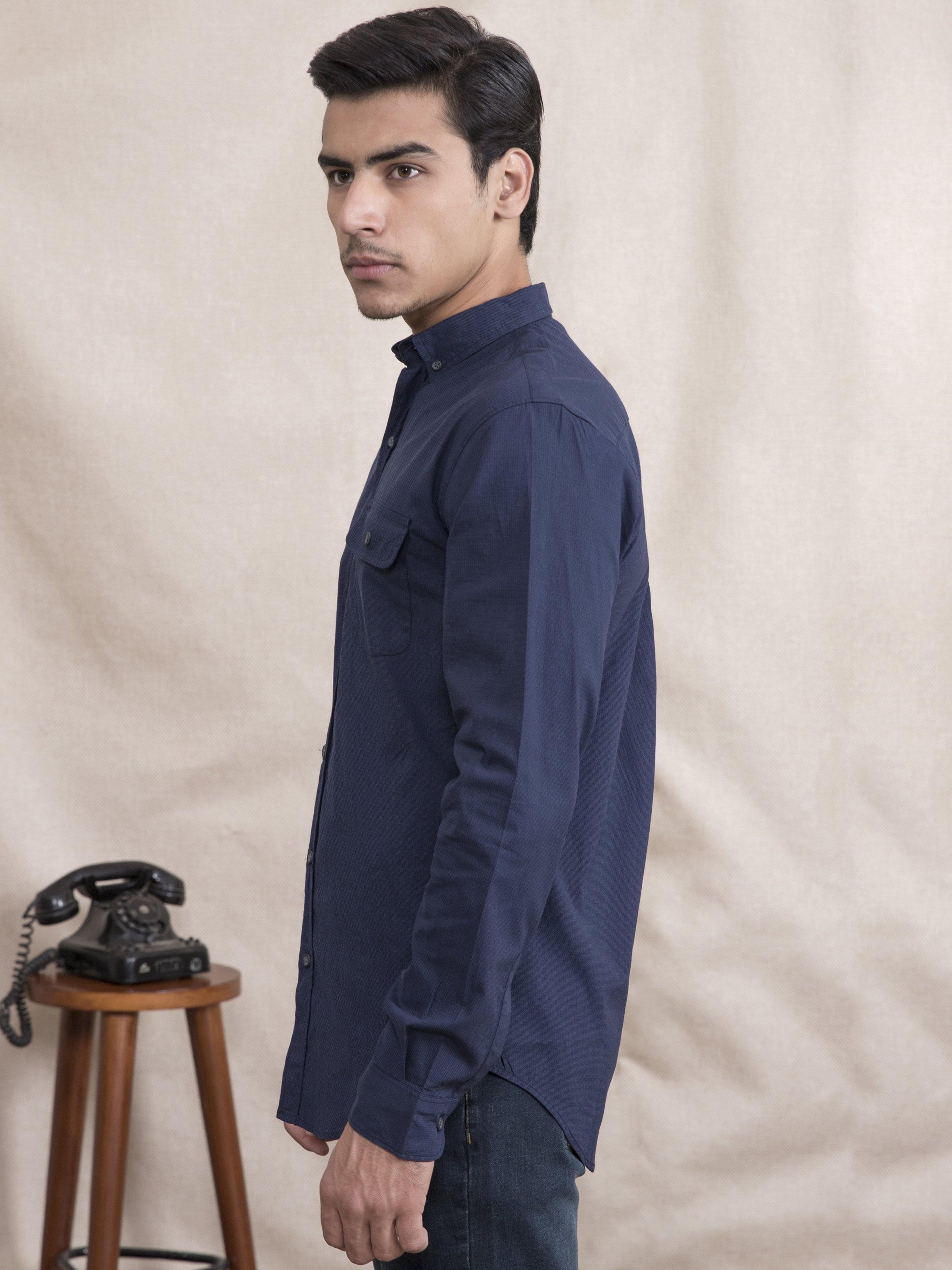 Navy slim-fit button-up shirt with full sleeves, side view