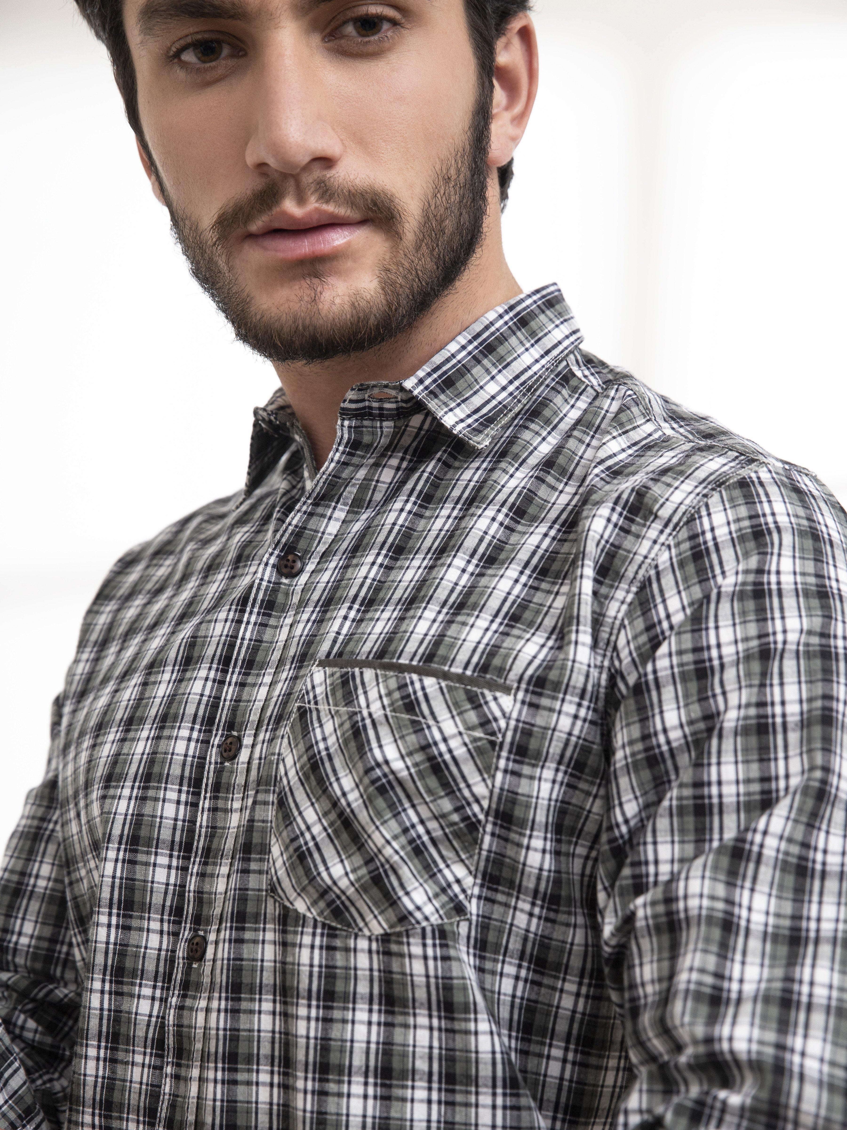 Men’s check button-up shirt detail: collar and chest pocket, green-and-white plaid