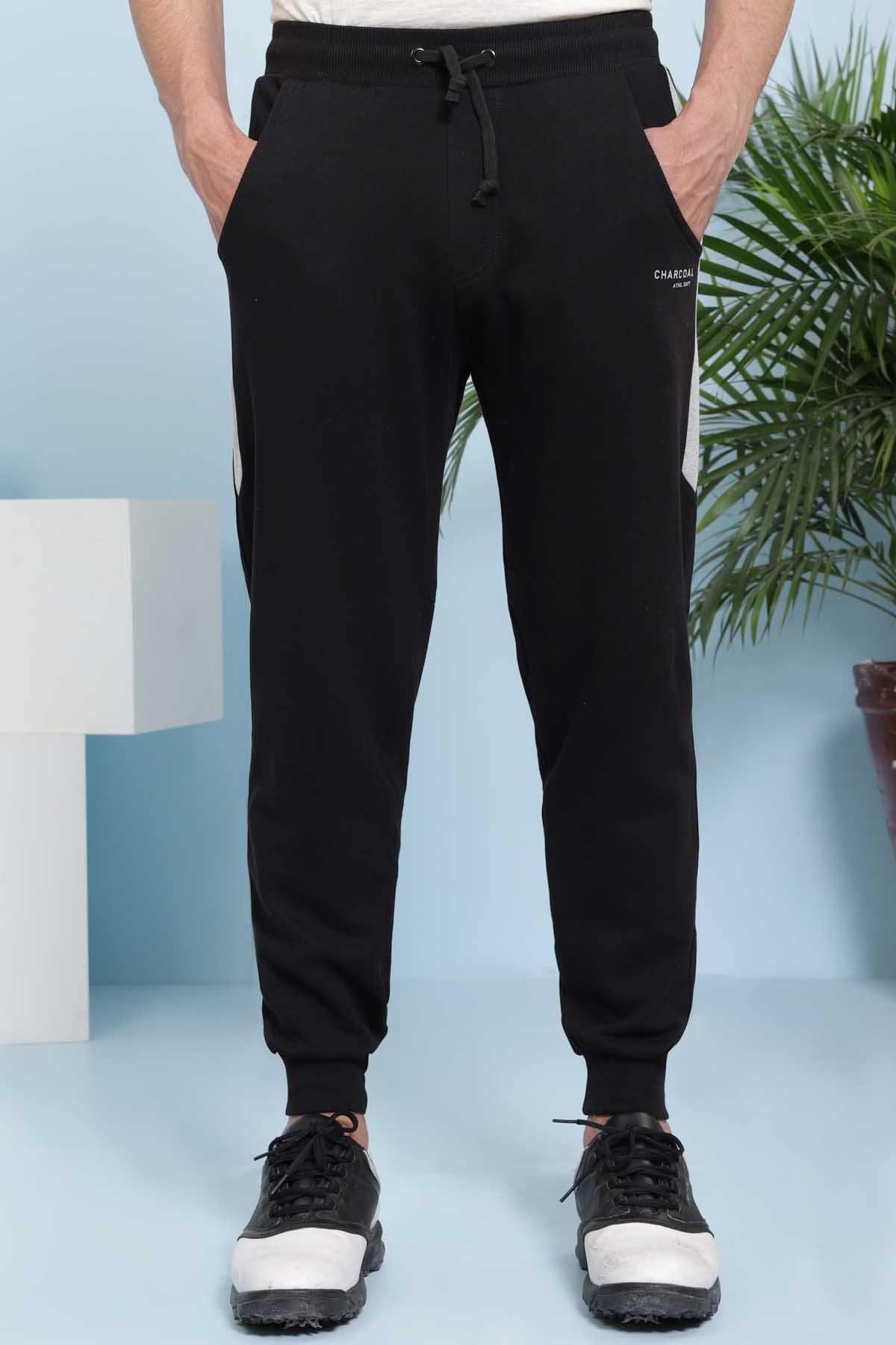 Black casual trousers with drawstring waist, tapered ankle cuffs, side pockets
