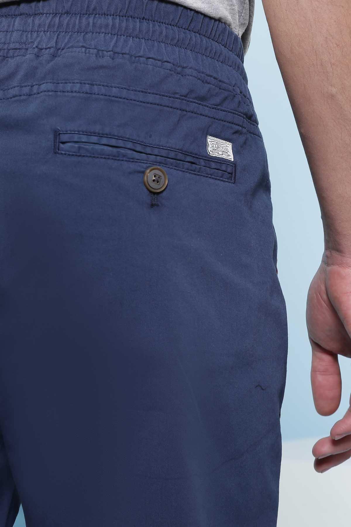 Men's blue casual trousers close-up: side button and pocket detail
