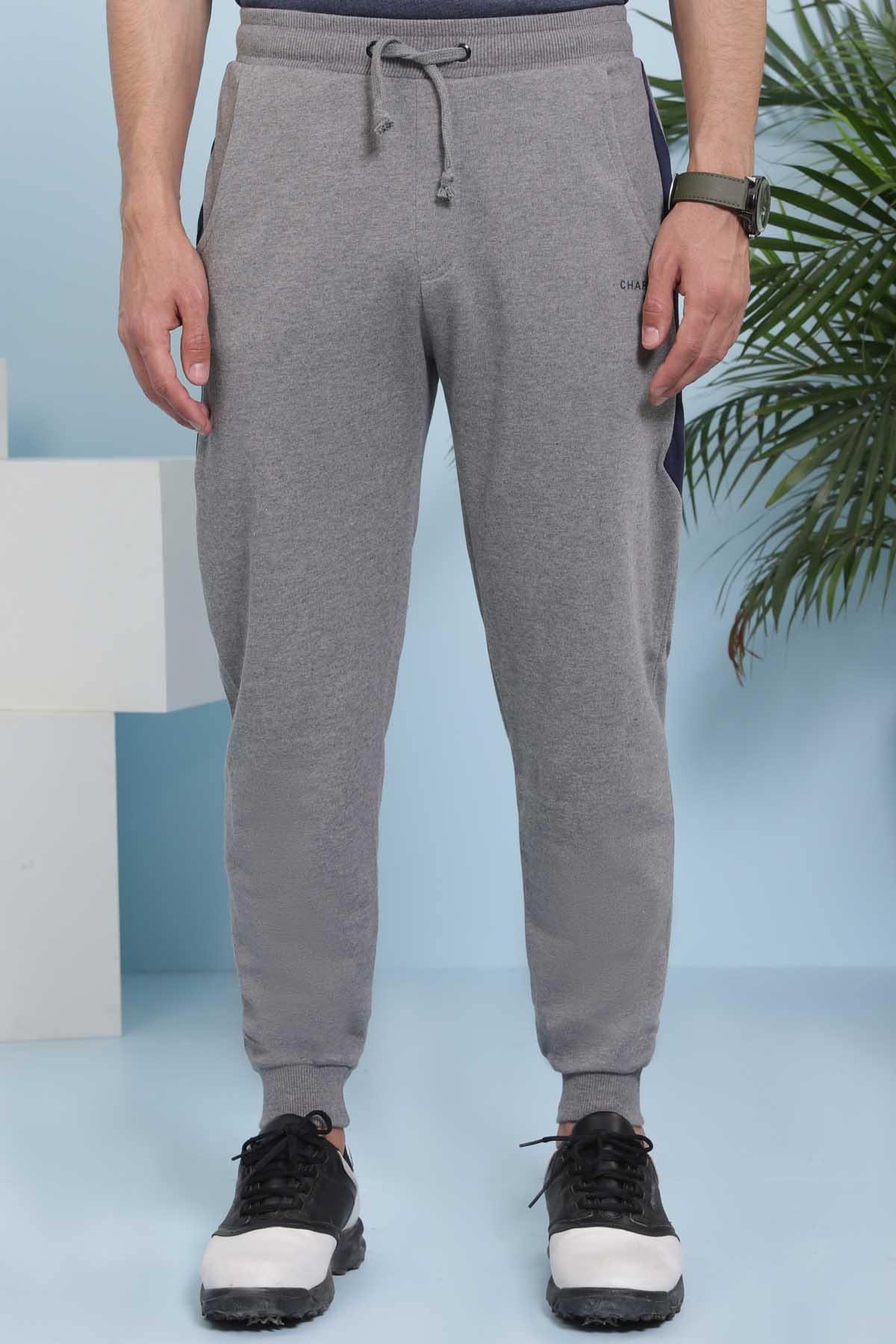 Charcoal grey jogger trousers with drawstring waist and cuffed tapered legs