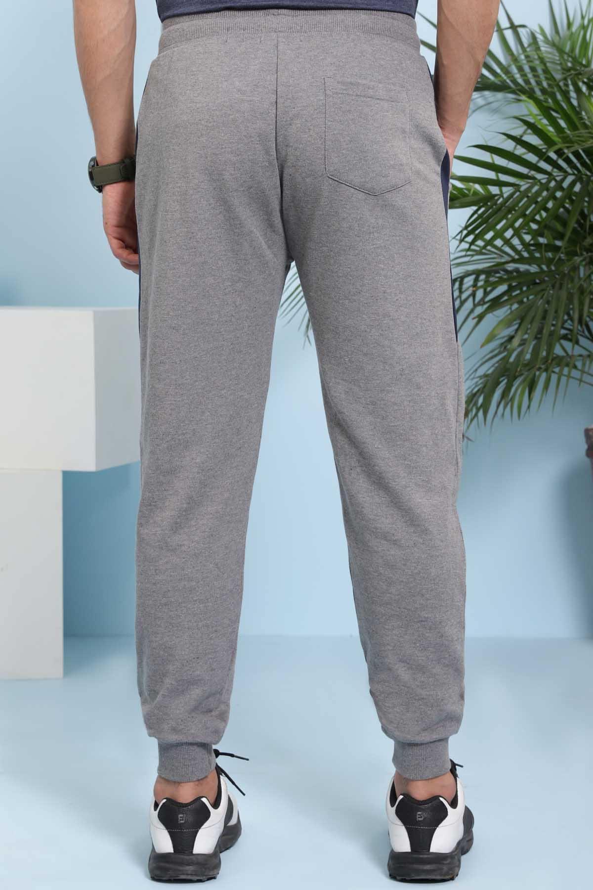 Charcoal grey jogger trousers with side pockets and elastic cuffs, rear view