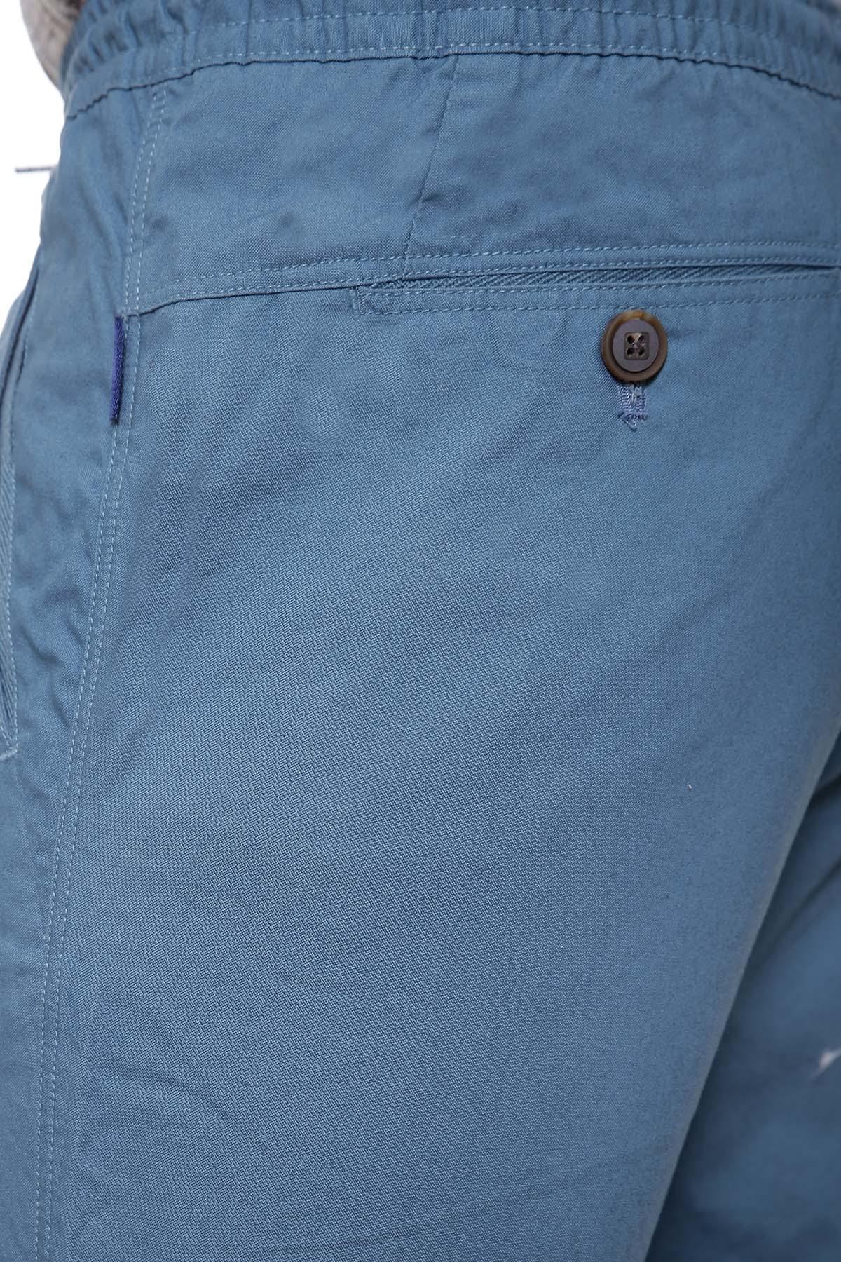Blue casual trouser fabric with button detail near waistband