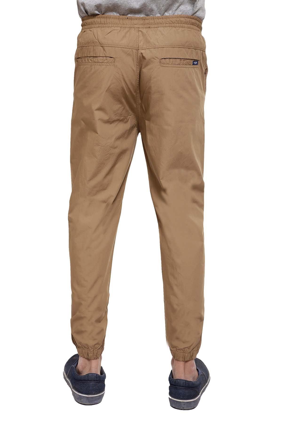Dark khaki casual trousers with cuffed hems and side slash pockets