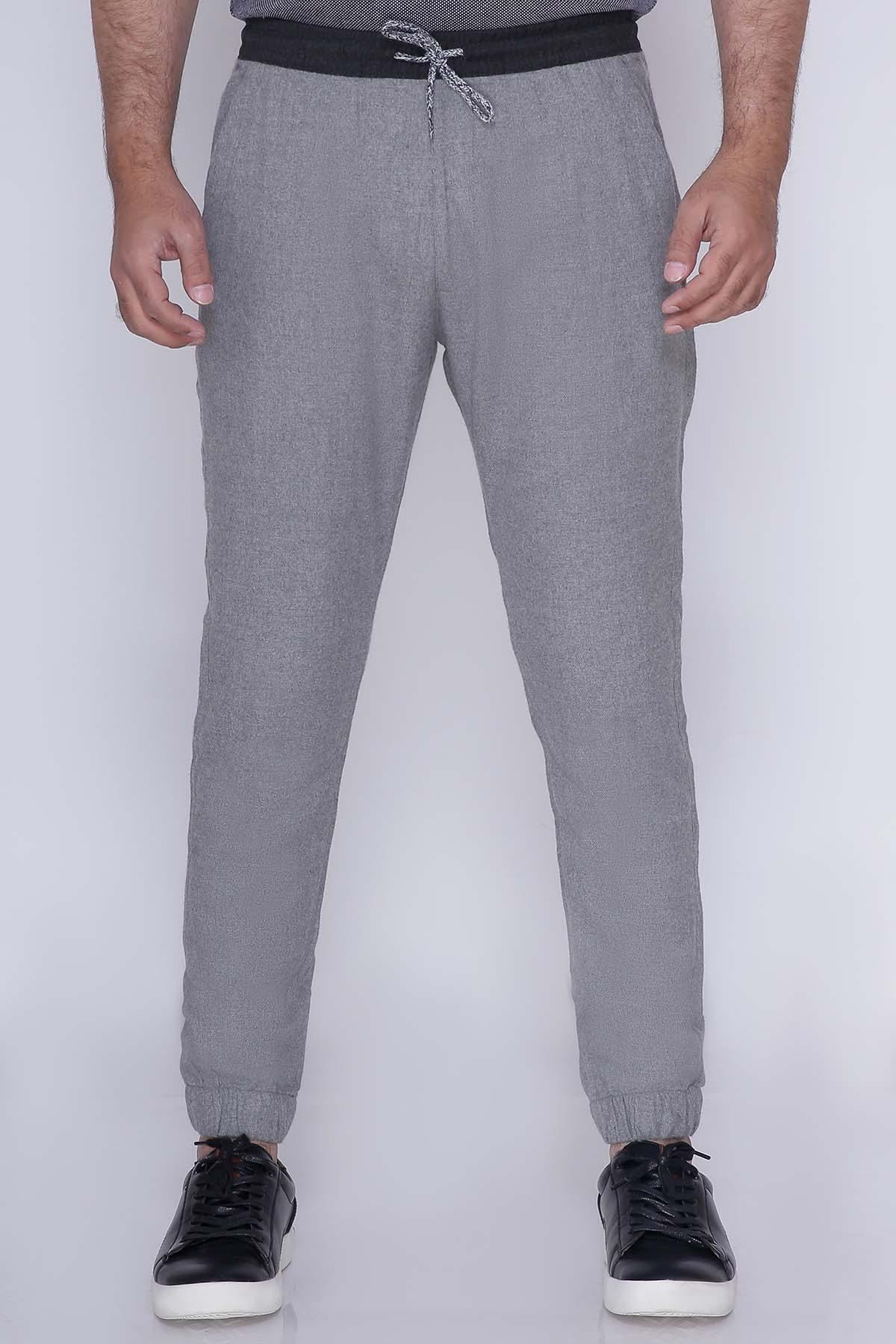 Grey casual trousers with drawstring waistband and side pockets, tapered legs