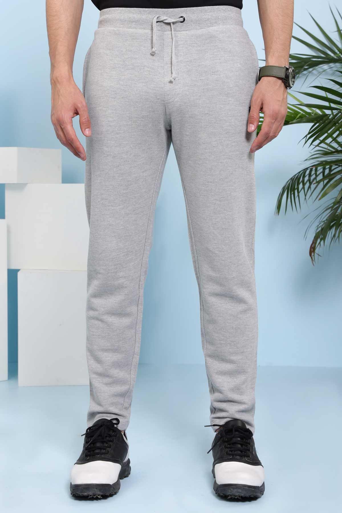 Grey casual trousers with drawstring waistband and tapered legs