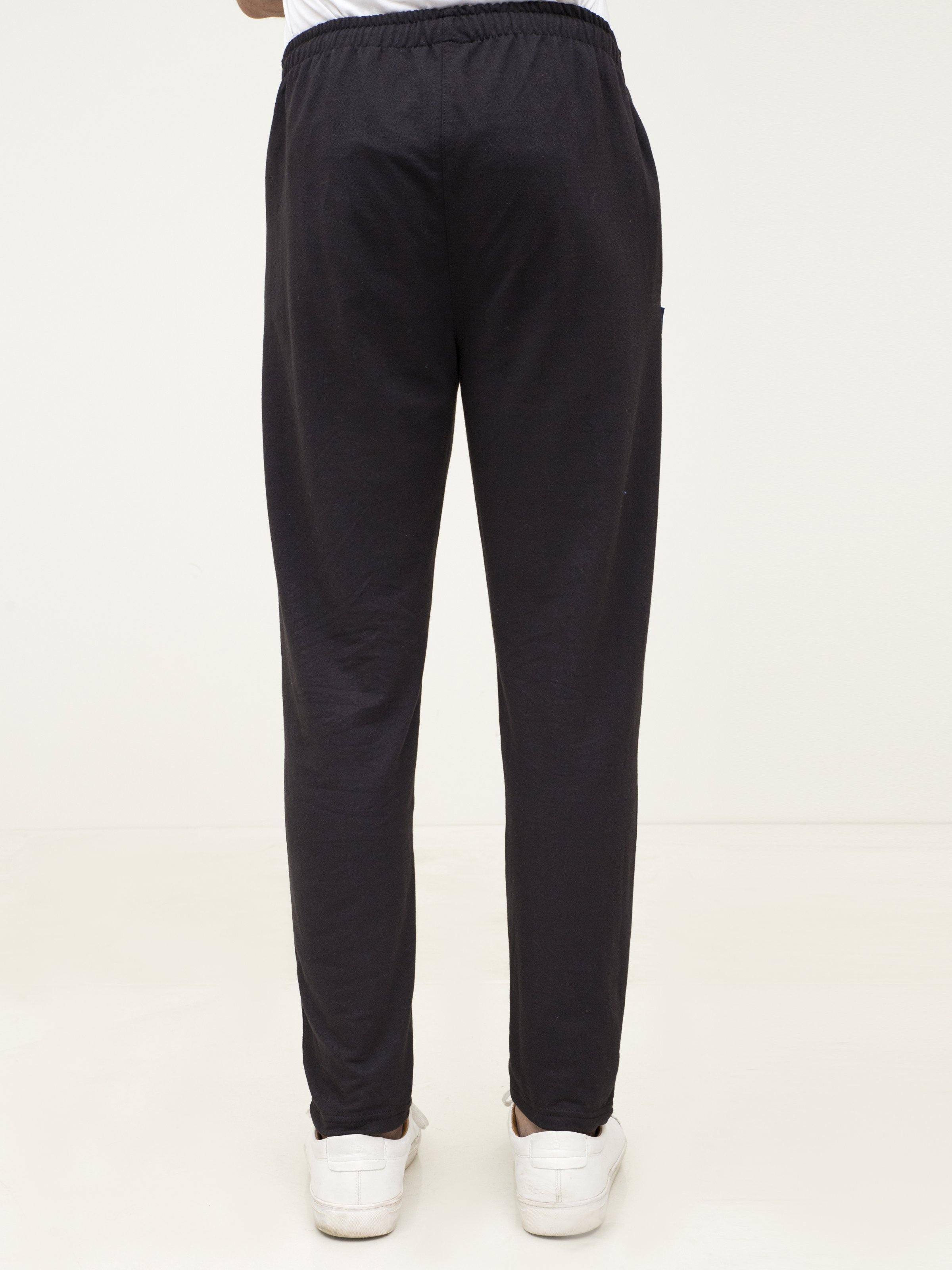 Black knit sleep trousers, back view with elastic waistband and straight tapered legs