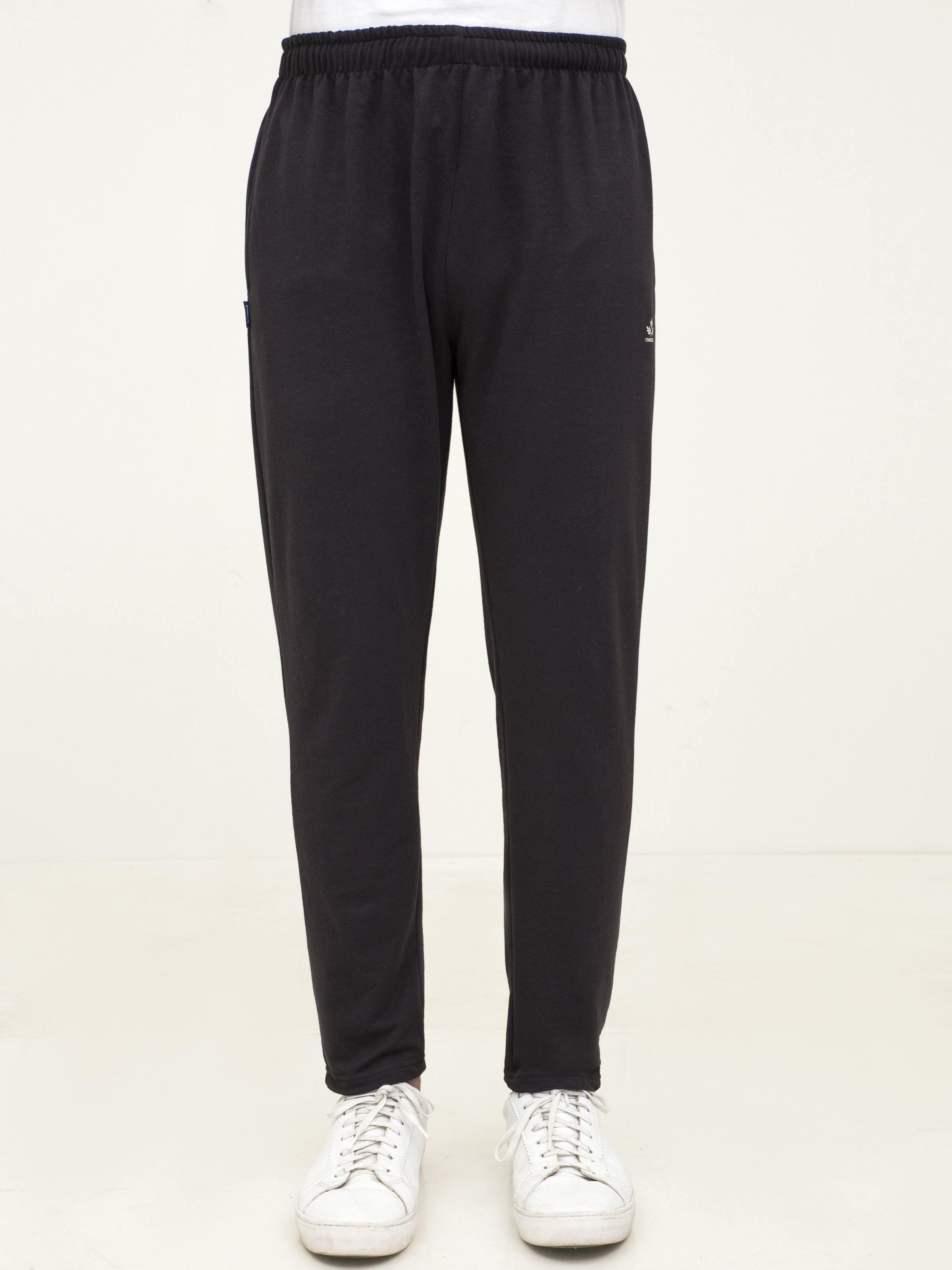 Black knit sleep trousers front view with elastic waist, cuffed tapered legs