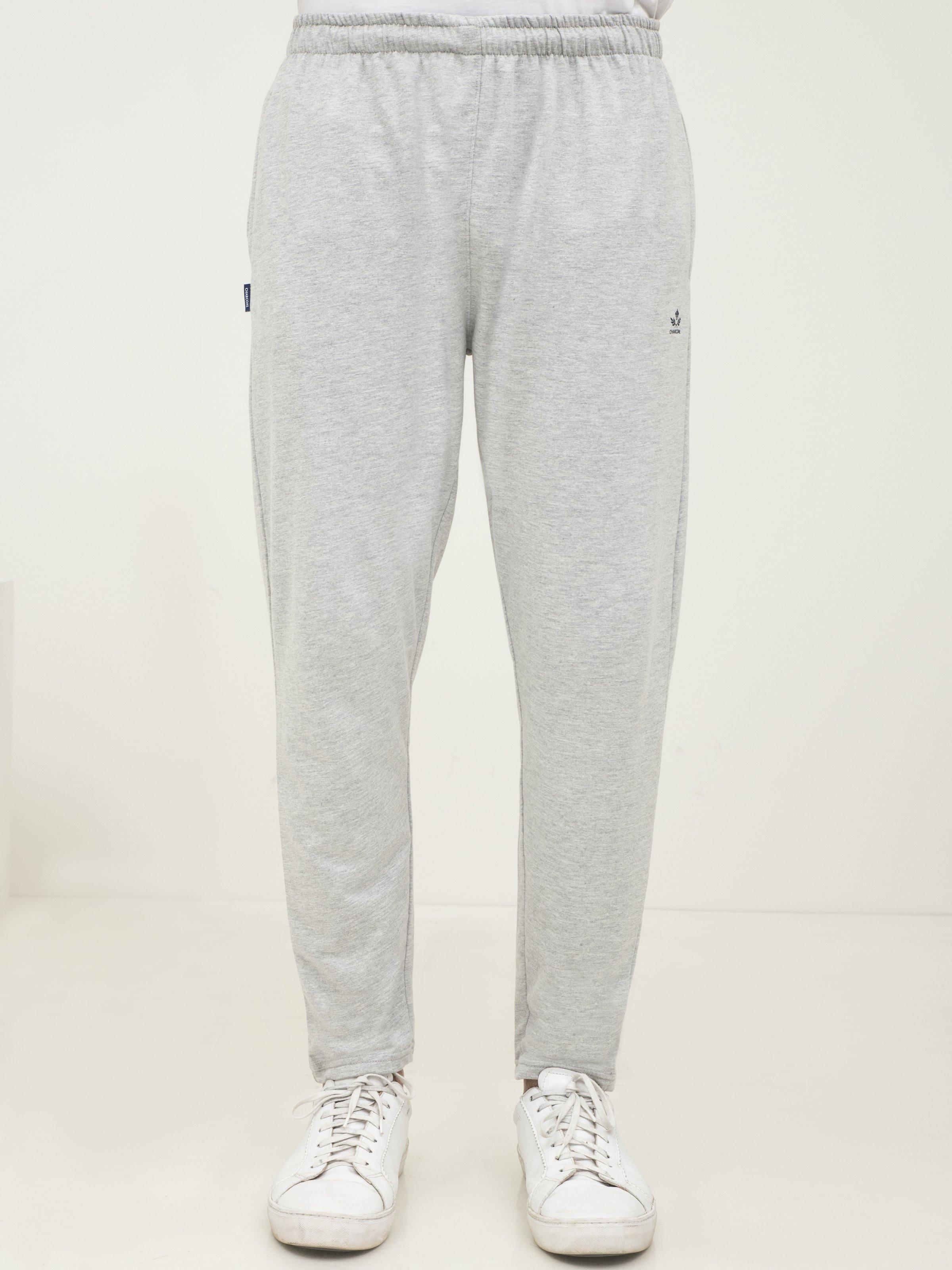 Light grey knit lounge trousers with elastic waist, relaxed legs and ankle cuffs
