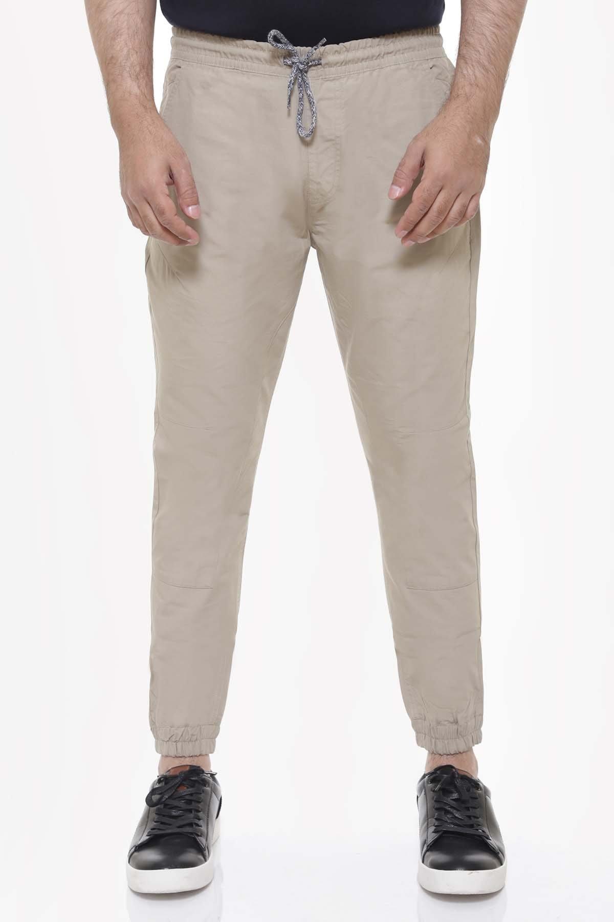 Light khaki casual trousers with drawstring waist and tapered ankle cuffs
