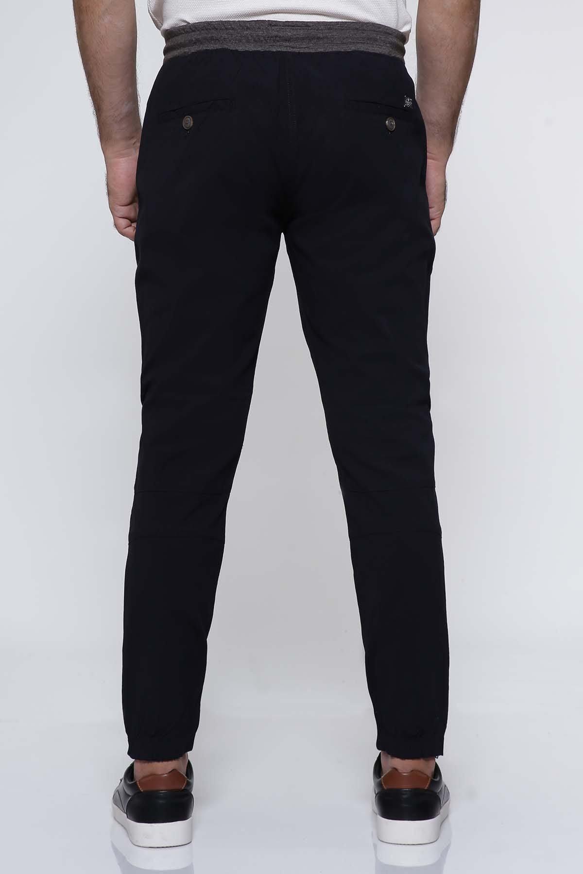 Navy casual trouser rear view with tapered legs and cuffed hems