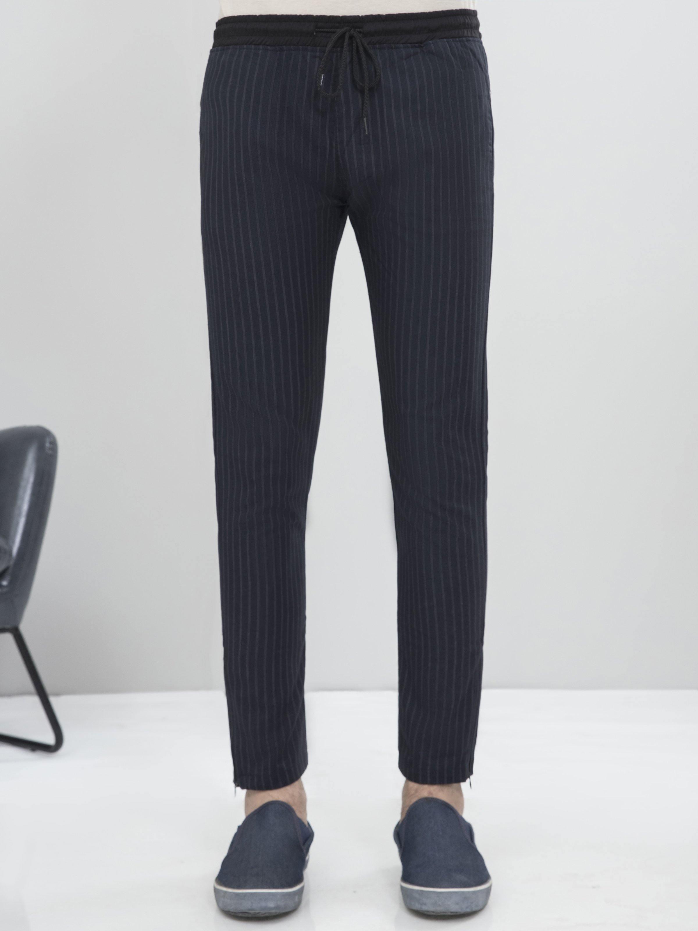 Charcoal grey tapered casual trousers with elastic waistband and drawstring, side view
