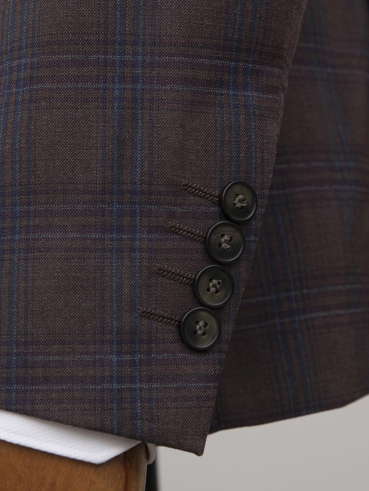 Brown check suit jacket side with three-button cuff detail