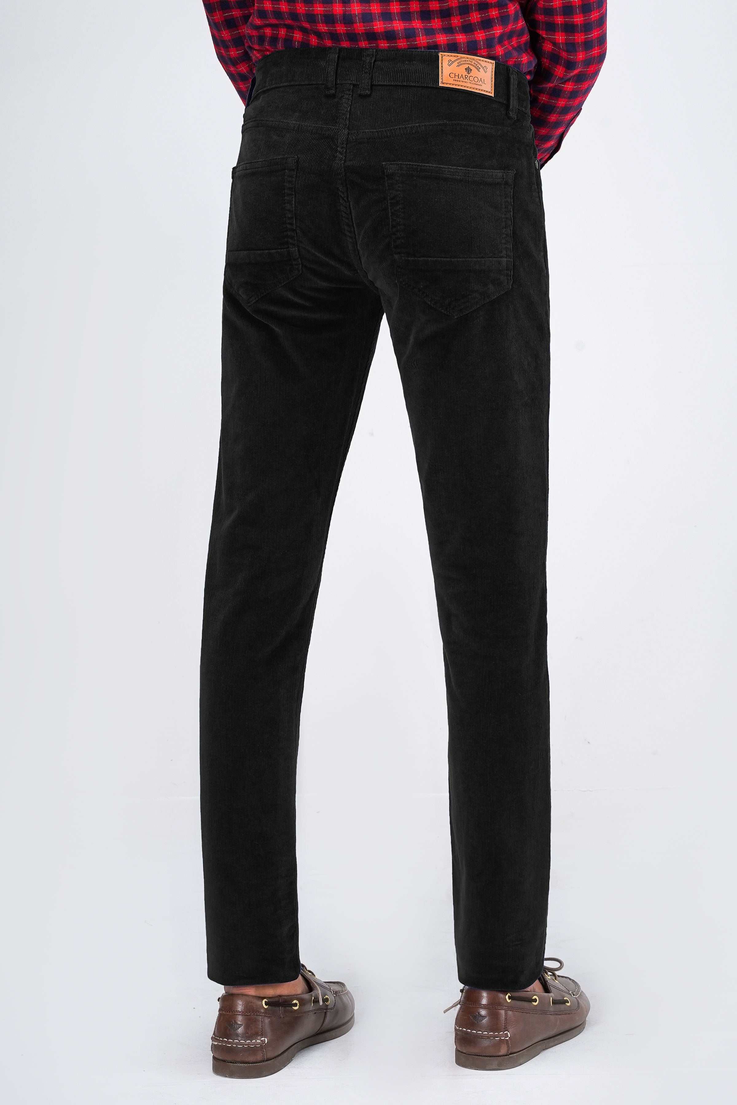Black corduroy 5-pocket pant, back view with waistband logo patch