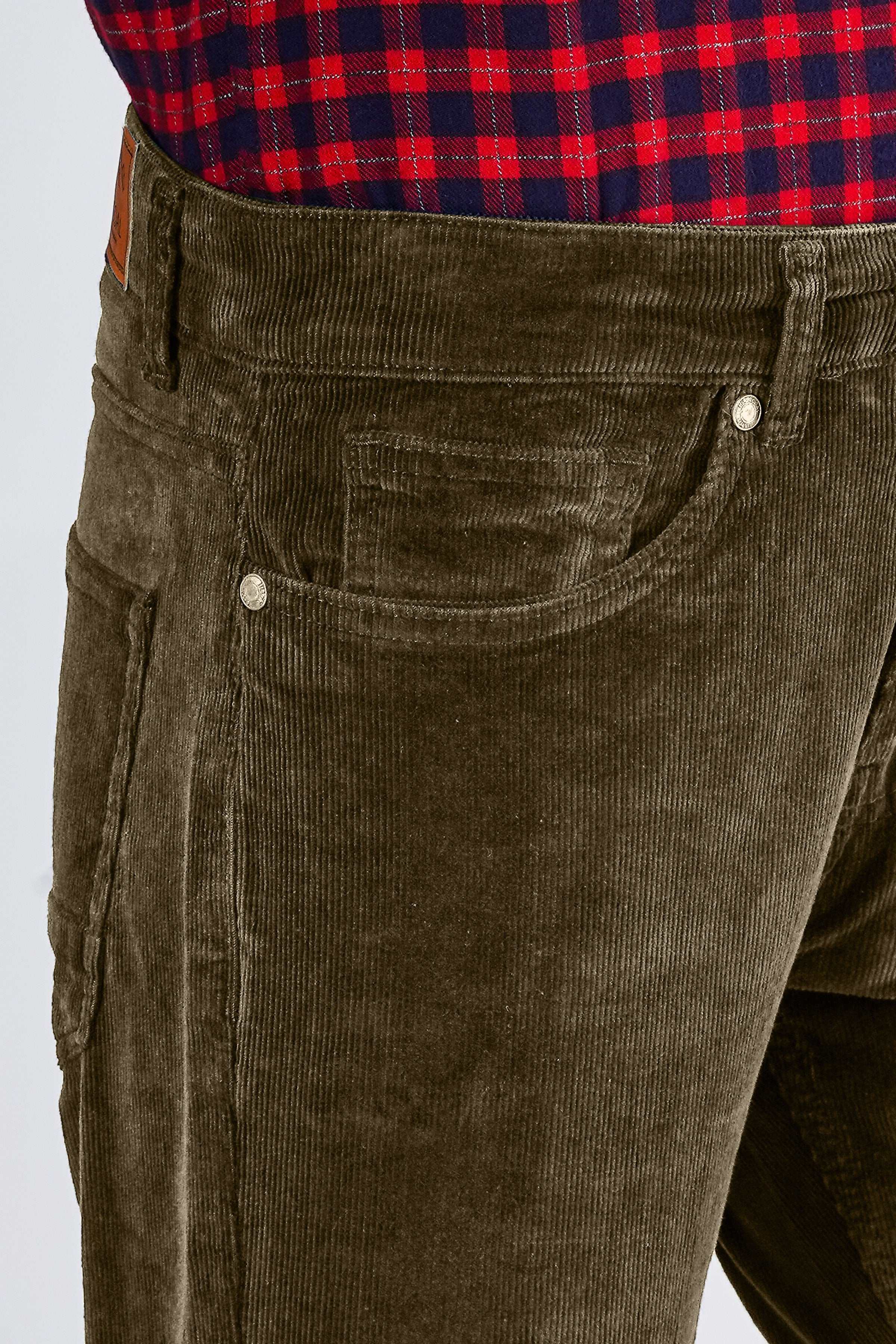Dark khaki corduroy pants close-up of waistband and front buttoned pocket.