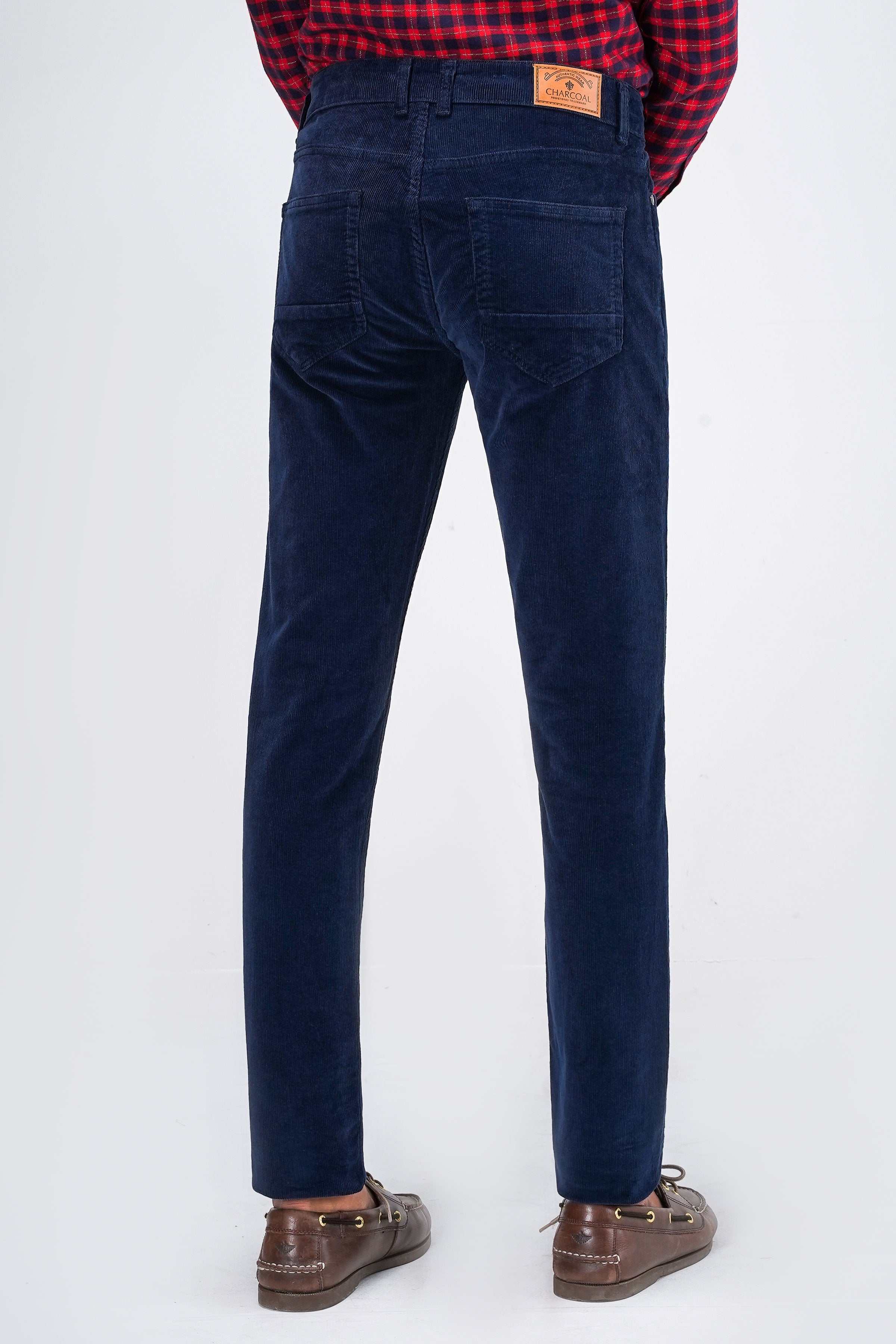 Navy corduroy 5-pocket pant, back view with belt loops and patch logo