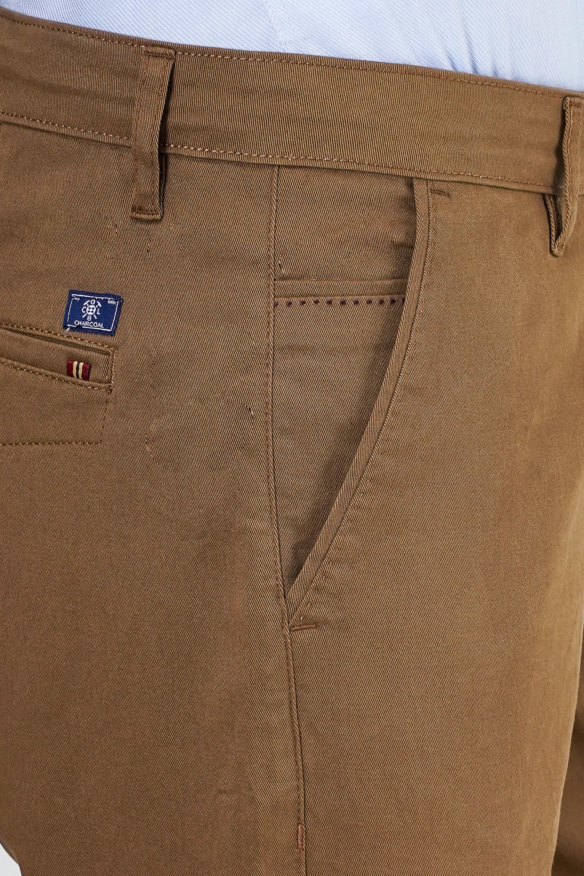 Dark khaki casual pants close-up: pocket stitching, belt loop, fly seam
