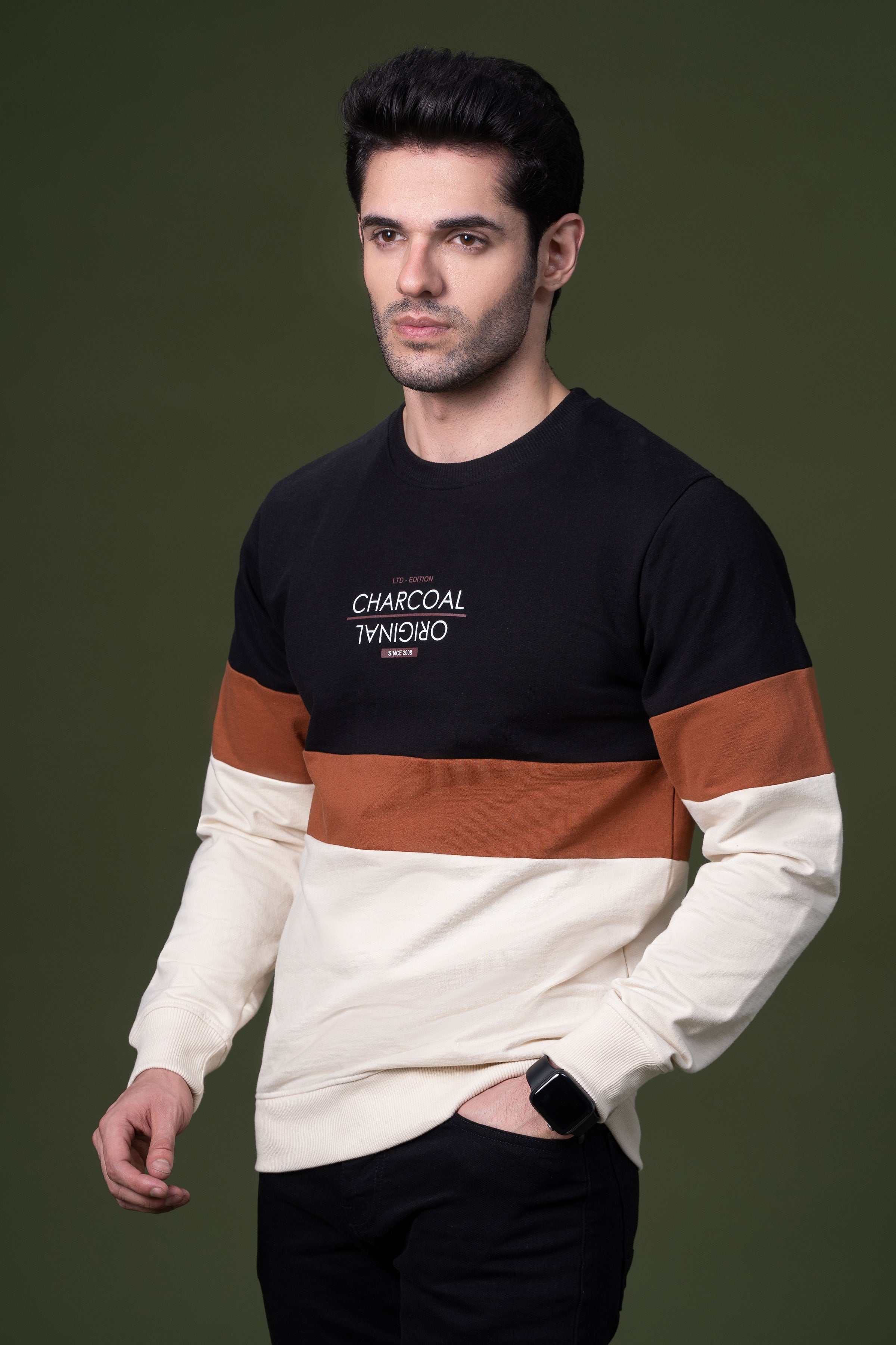 Colorblock sweatshirt in black with rust stripe, cream lower panel; long sleeves