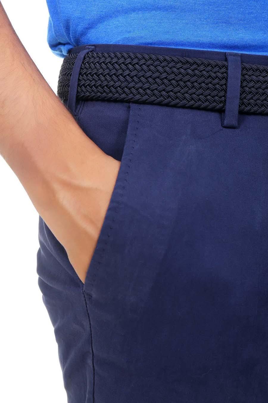 Navy waistband and cross pocket area on slim-fit casual pants