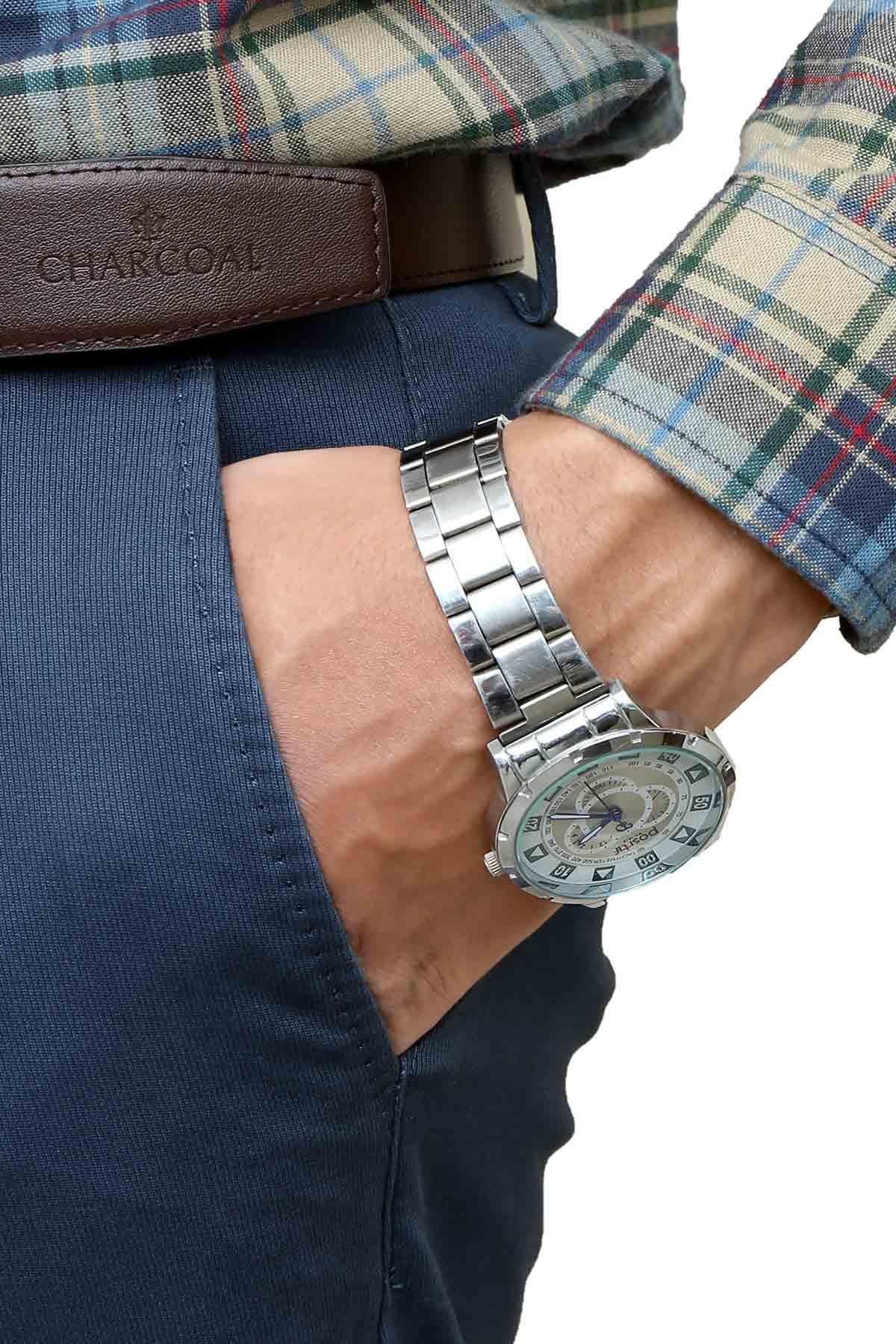 Blue five-pocket pants with brown leather waistband and front pocket seam