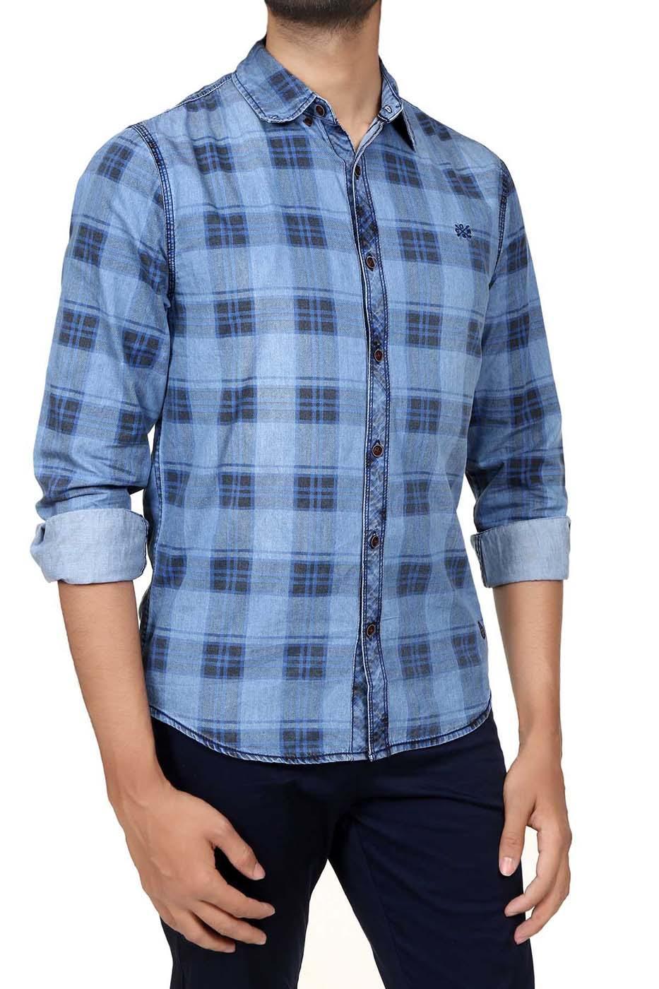 Casual plaid denim shirt worn with button-up front and rolled cuffs