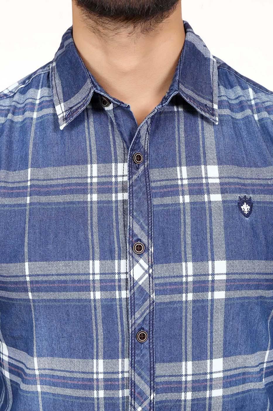 Men's denim plaid shirt close-up with button placket and chest crest patch