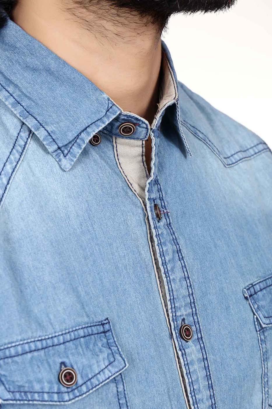 Light blue denim casual shirt close-up of collar, button placket, and chest pocket