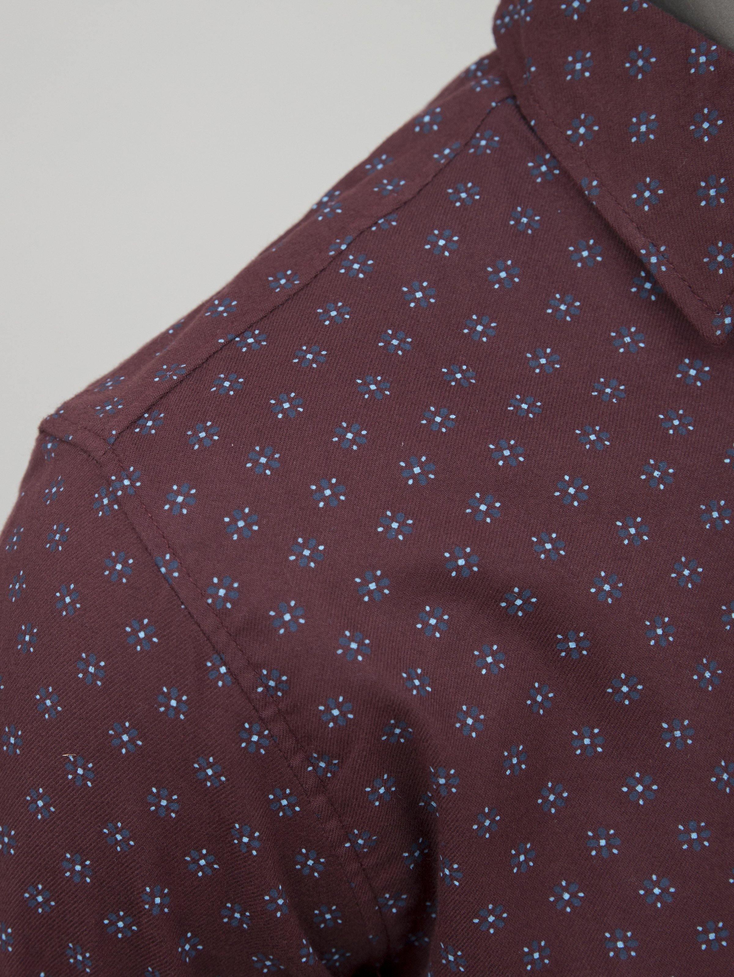 Maroon patterned casual shirt collar and button placket close-up