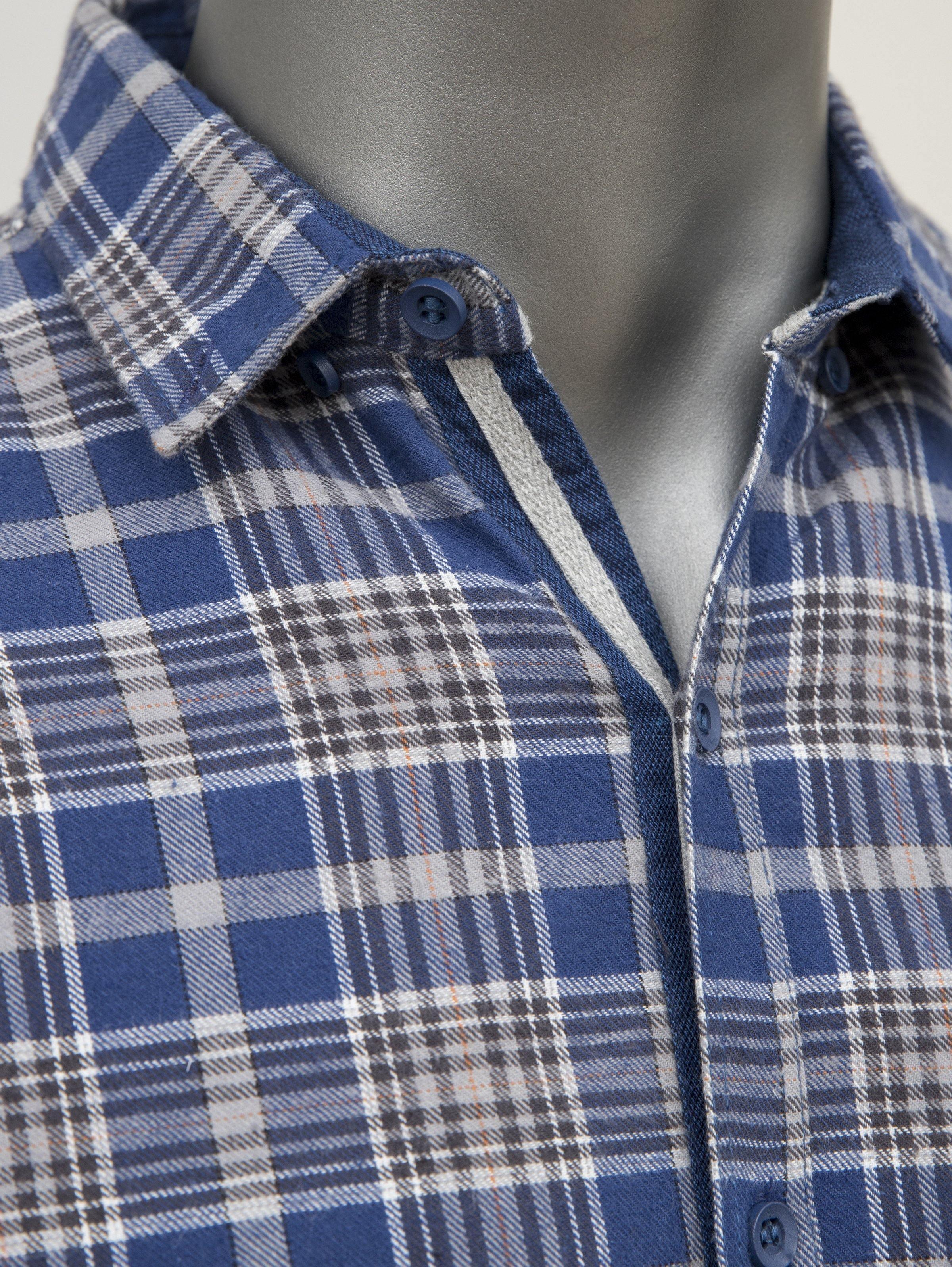 Close-up of blue-and-white plaid shirt collar and button placket