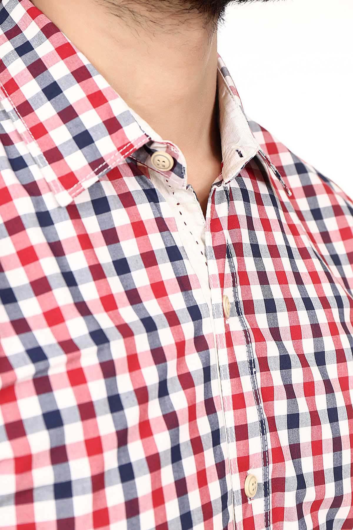 Close-up of red, navy & white check shirt collar and button placket