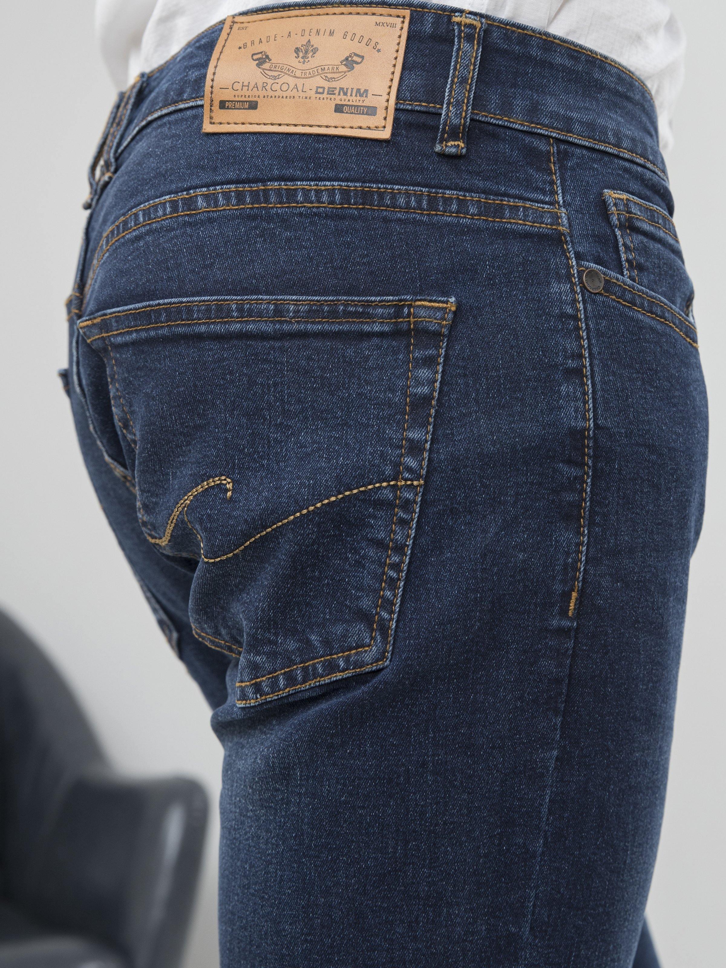 Dark blue slim-fit jeans back pocket with brand patch and contrast stitching