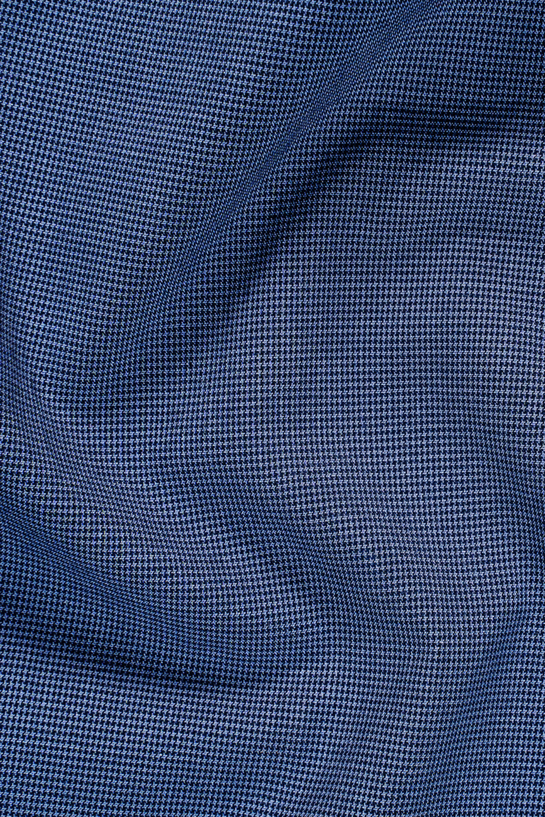 Blue self-textured fabric close-up with fine pattern texture