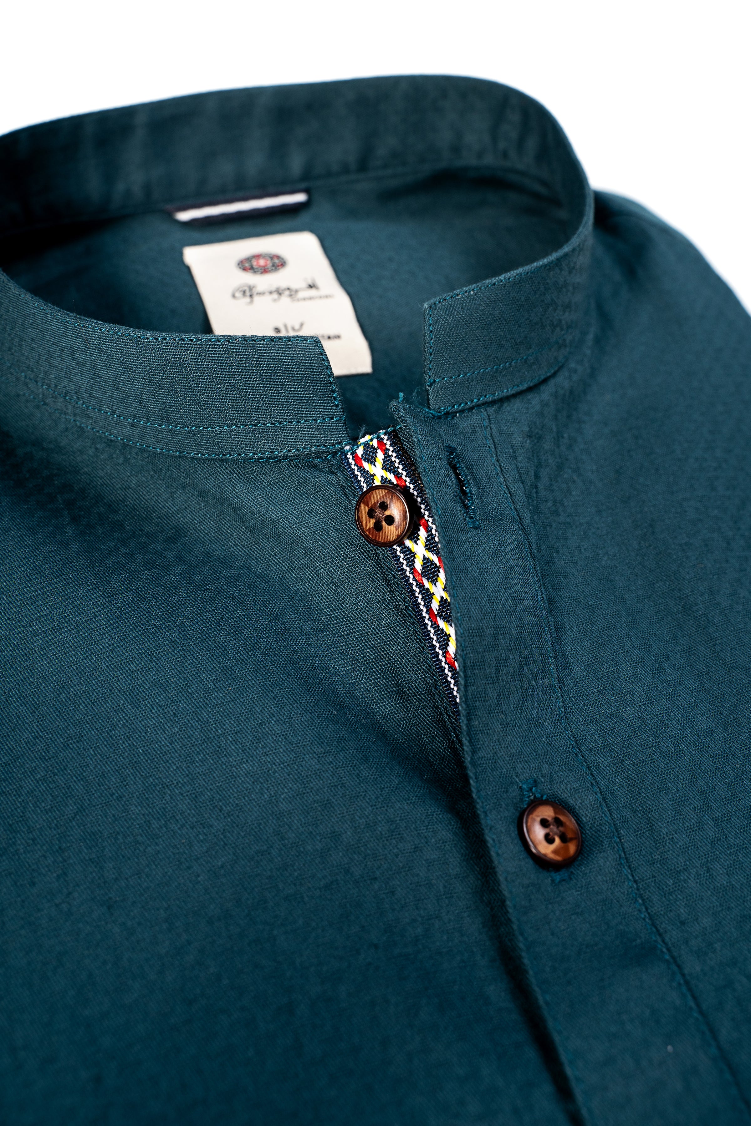 Forest green kurta collar detail with wooden-look buttons and trim