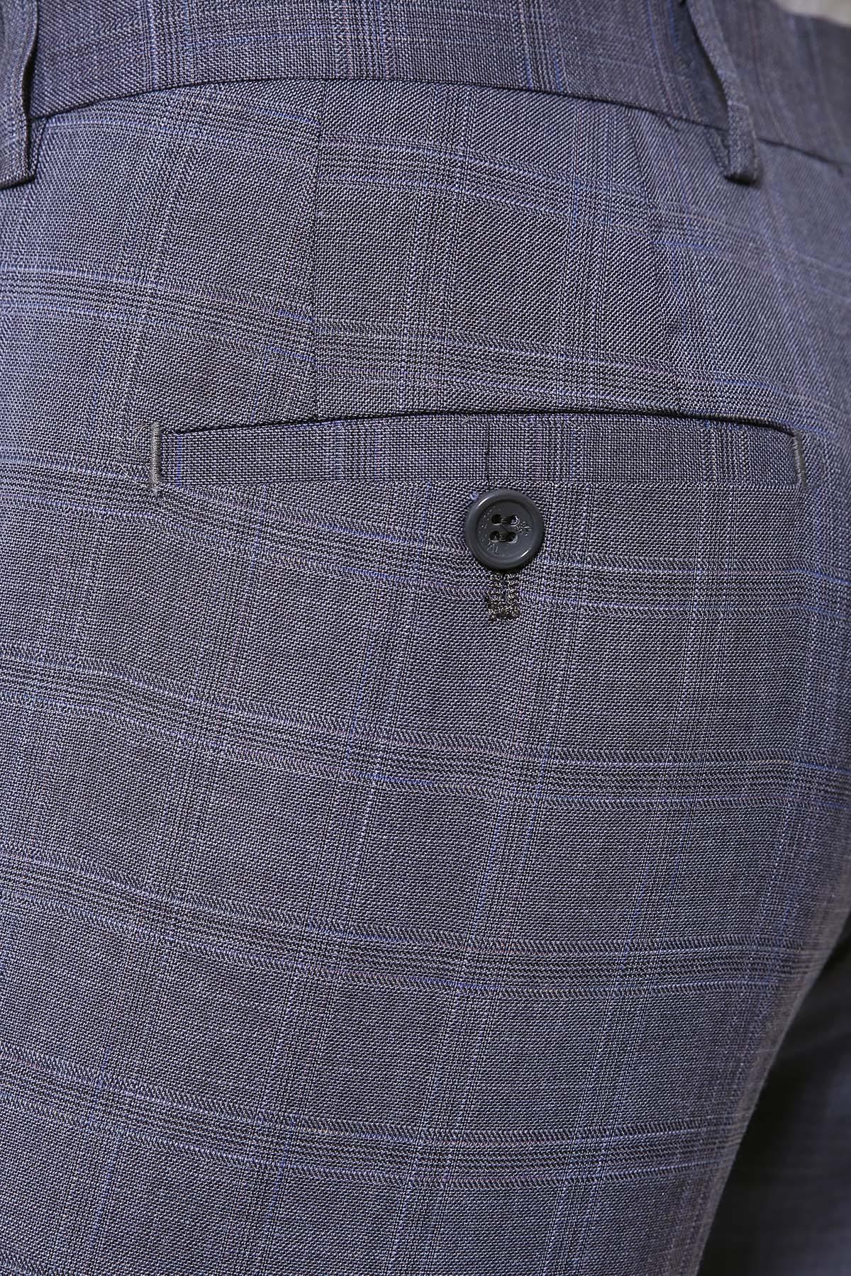 Slim-fit grey dress pants close-up: button, front pocket, and textured weave