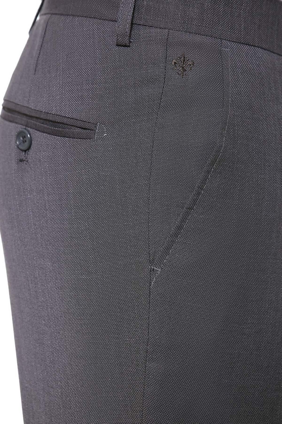 Grey dress pants close-up of hem, pocket opening, and button