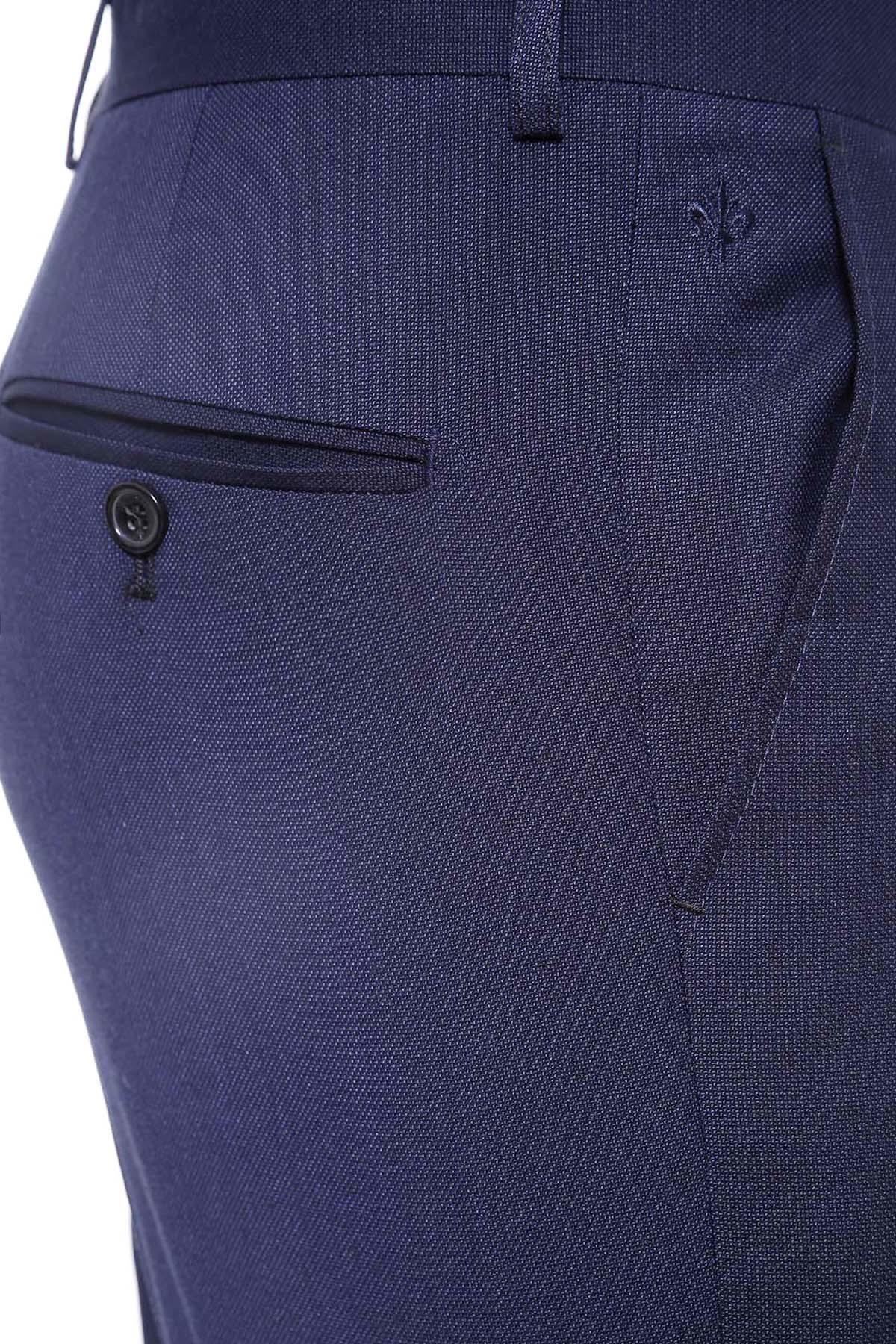 Navy dress pants close-up of front pocket flap and button detail