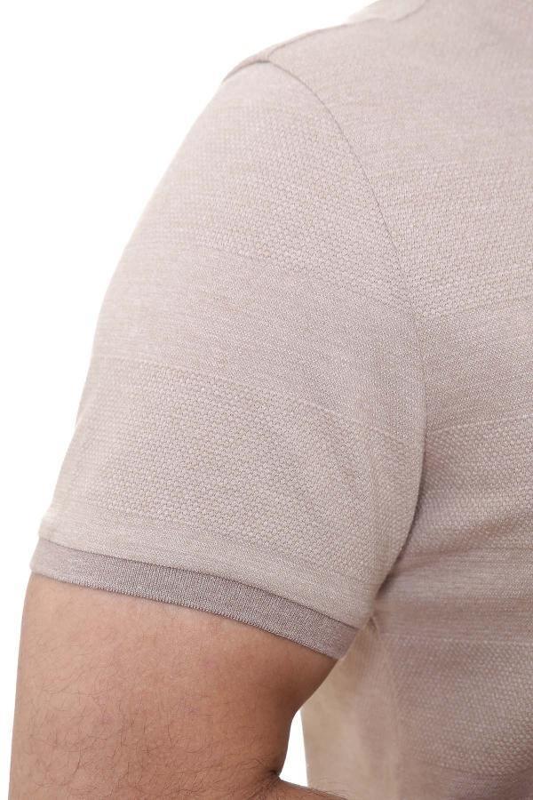 Light brown polo shirt sleeve close-up with textured fabric