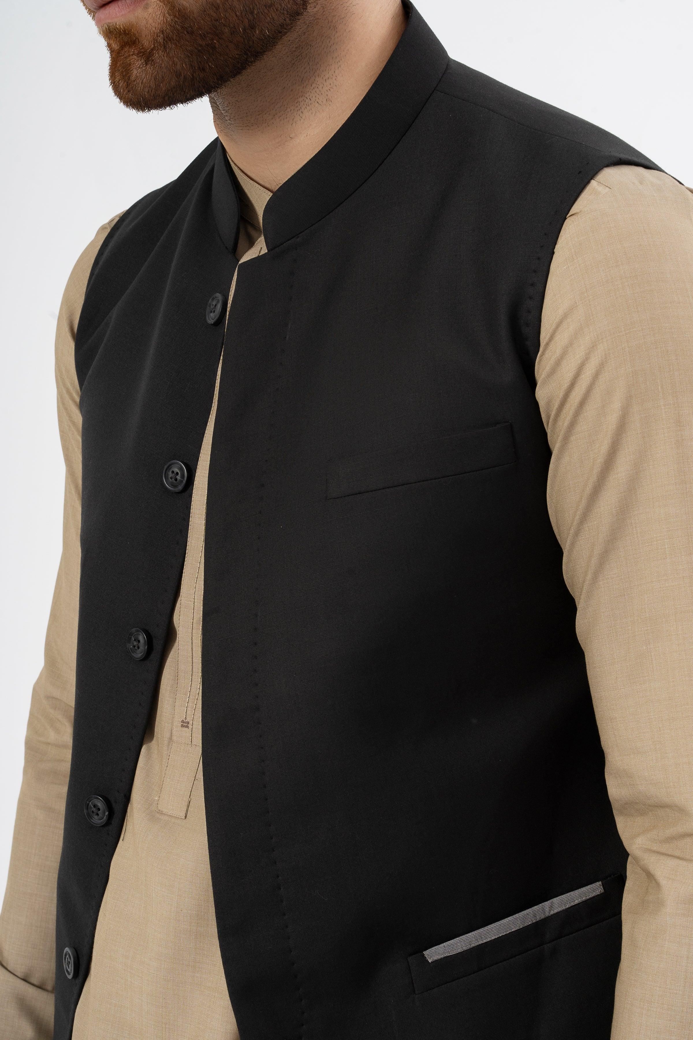 Black textured waistcoat close-up with stand collar, button placket, and welt chest pocket
