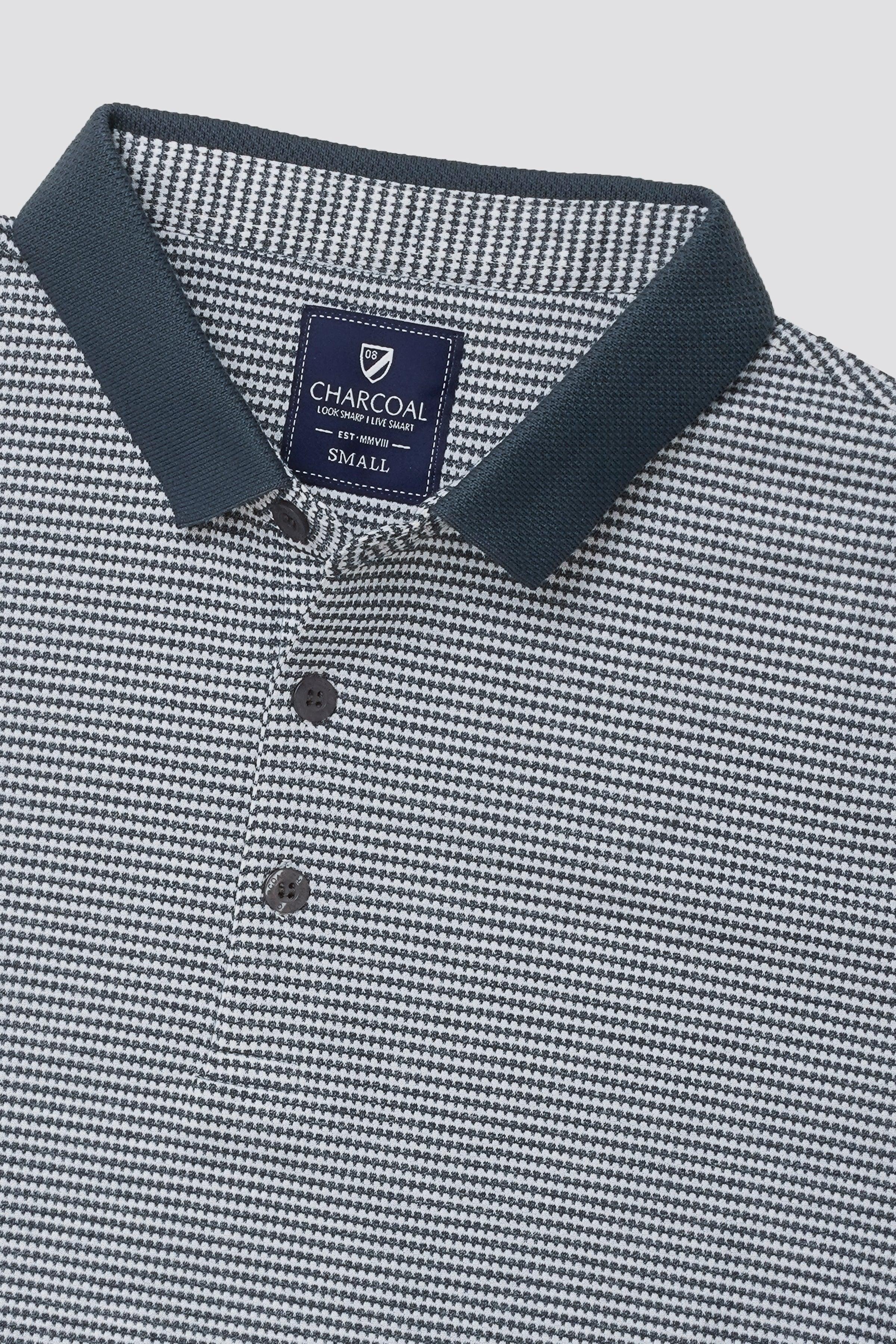 Houndstooth polo neckline with navy collar, button placket, and small chest logo patch
